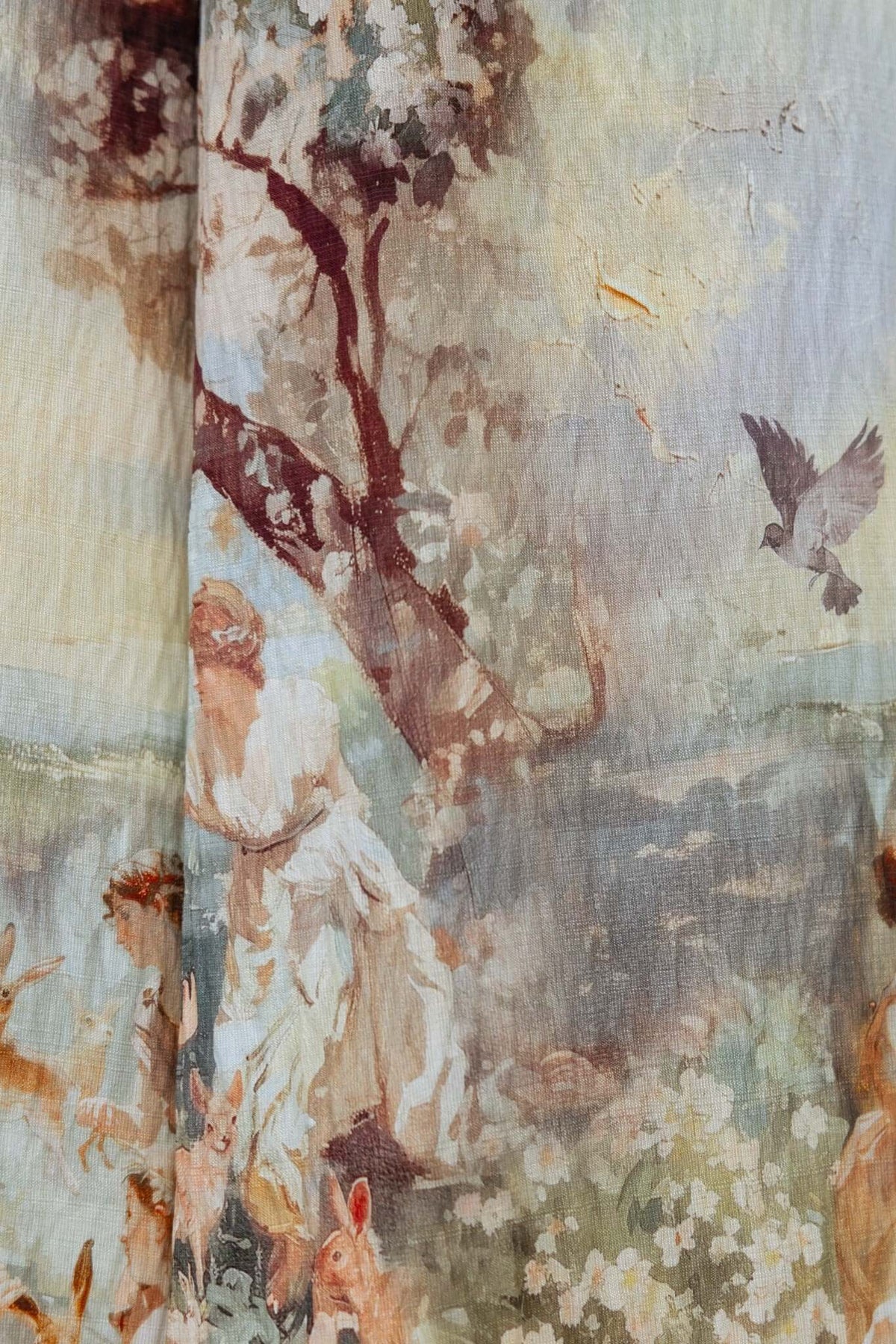 Abstract fabric print featuring a pastoral scene with figures and animals in soft colors.