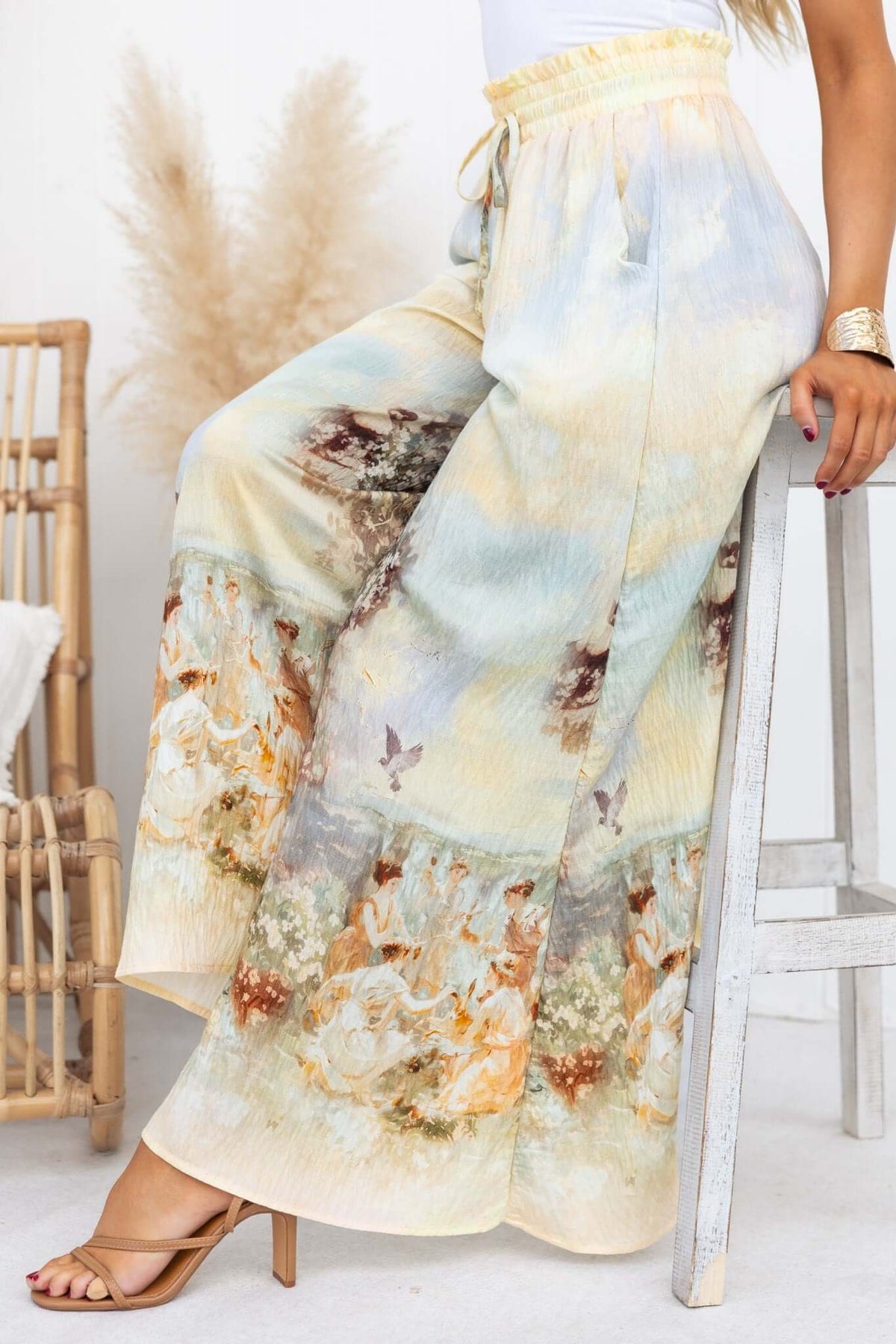 Grafton Pants featuring an abstract print, mid-high waist, and wide legs, styled with an elastic waistband and pockets.