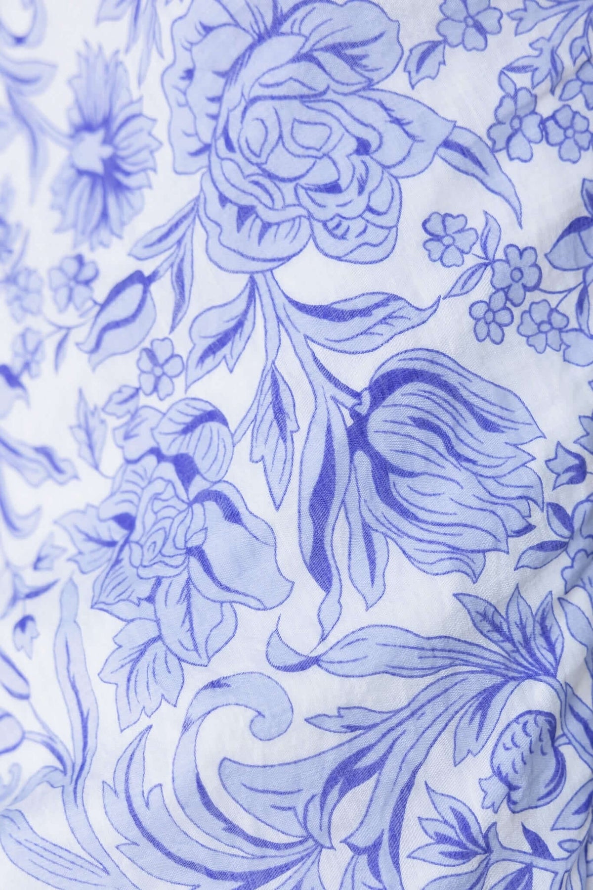 Light blue floral pattern featuring intricate roses and tulips on a white background.