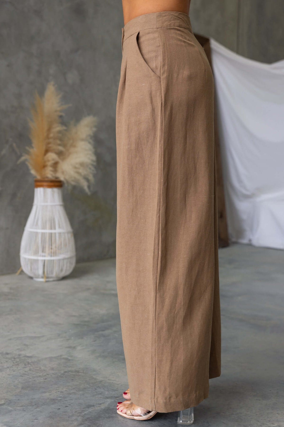 Carter's mid-high waist pants in beige, featuring pockets and a linen-like texture, perfect for summer wear.