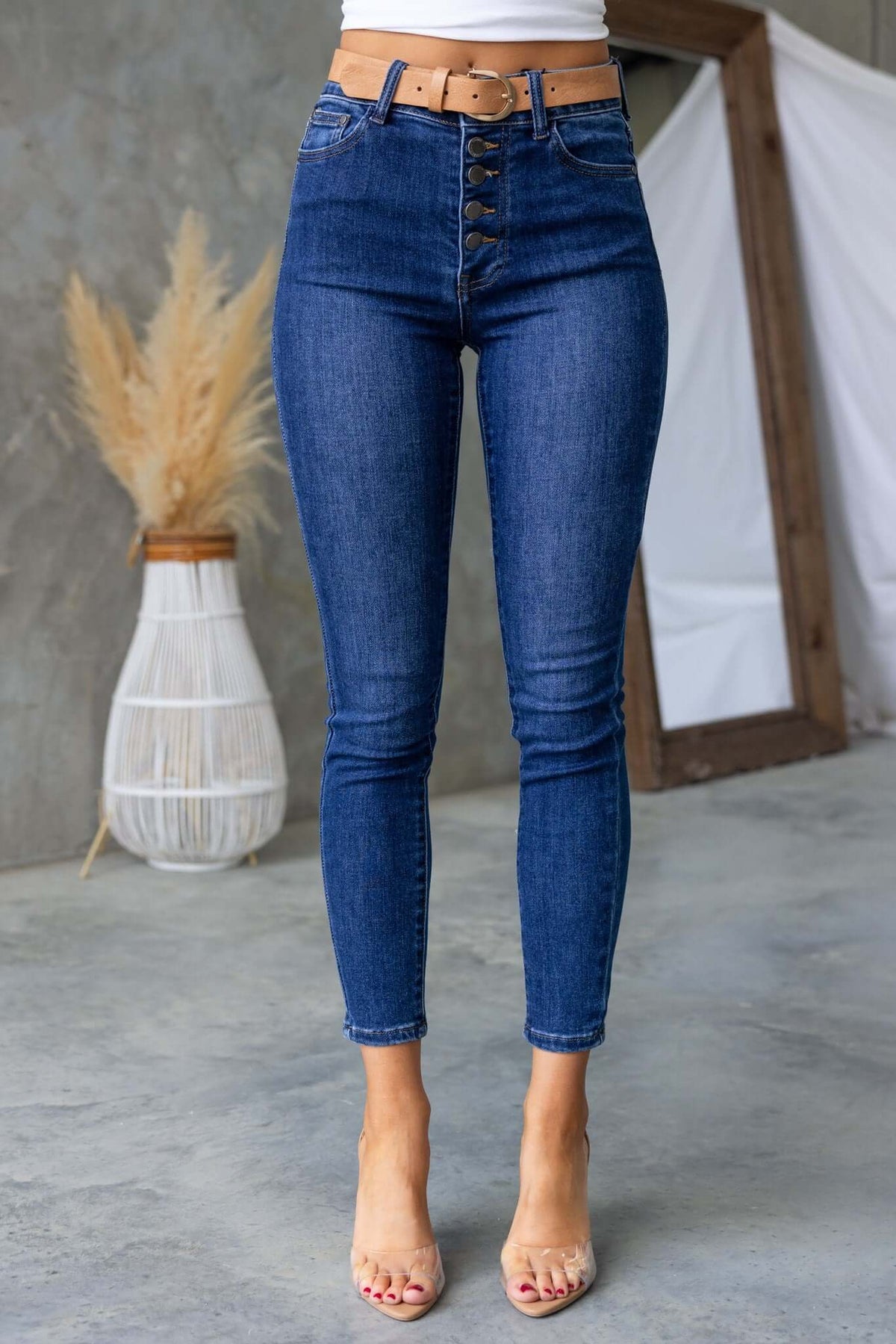 Under Cover Jeans: High-waisted denim with button-up front, pockets, and skinny fit, perfect for stylish looks.