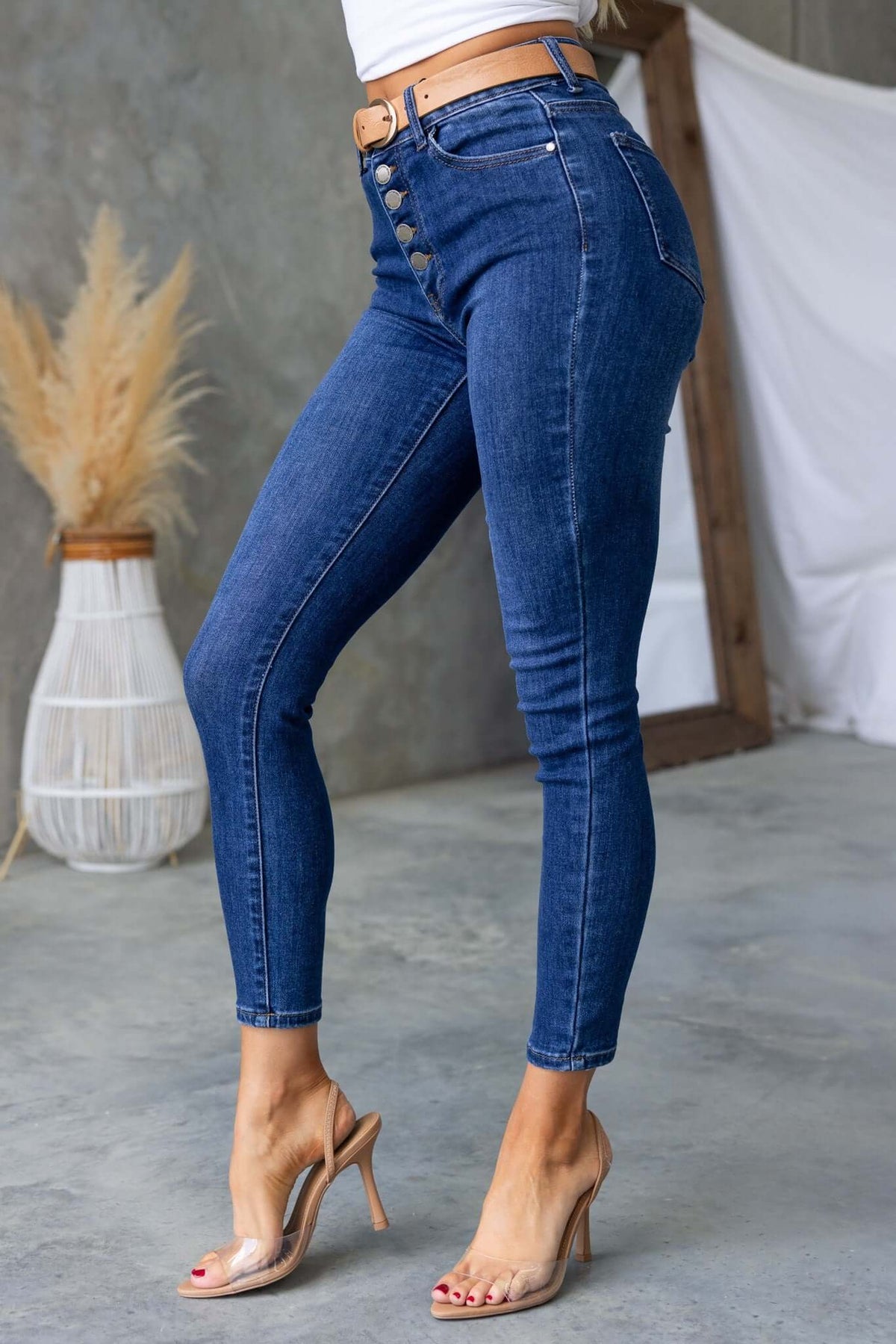 Under Cover Jeans featuring a skinny fit with a mid-high waist and button-up front, styled with heels.