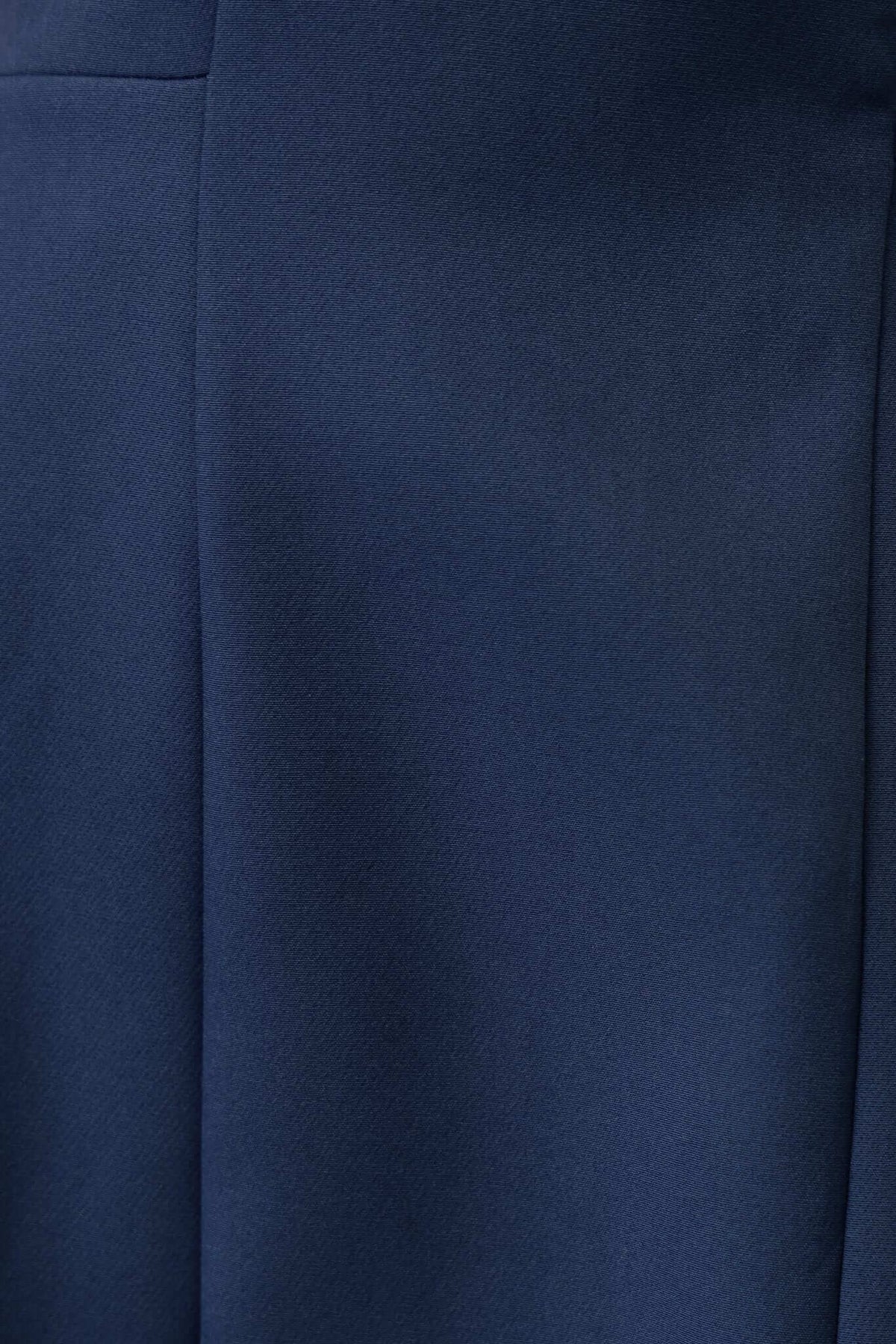 Close-up of the luxurious navy fabric of the Demure Dress, showcasing its smooth, non-stretch material for a refined look.