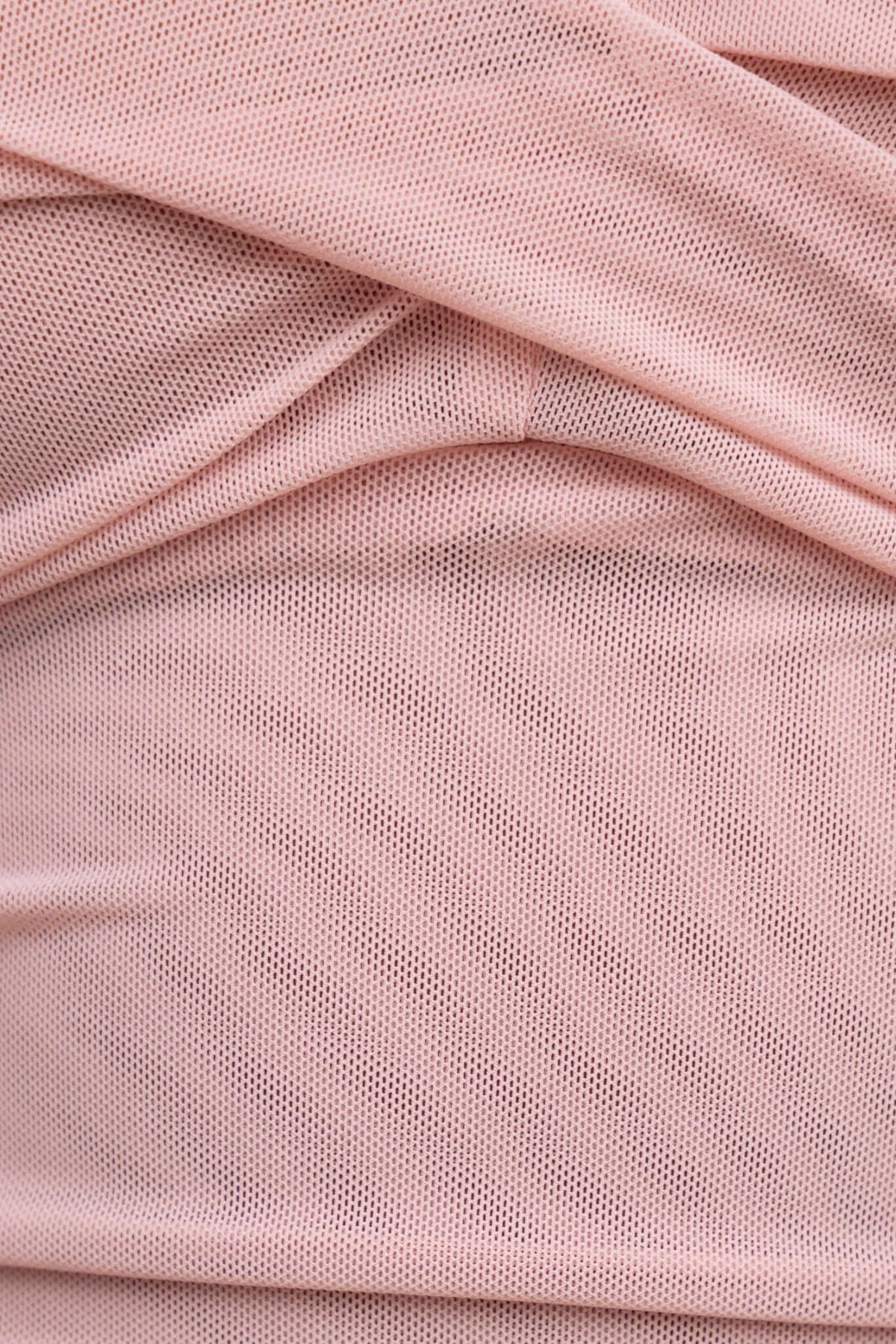 Close-up of soft pink mesh fabric with gathered texture, ideal for a stylish bodysuit.