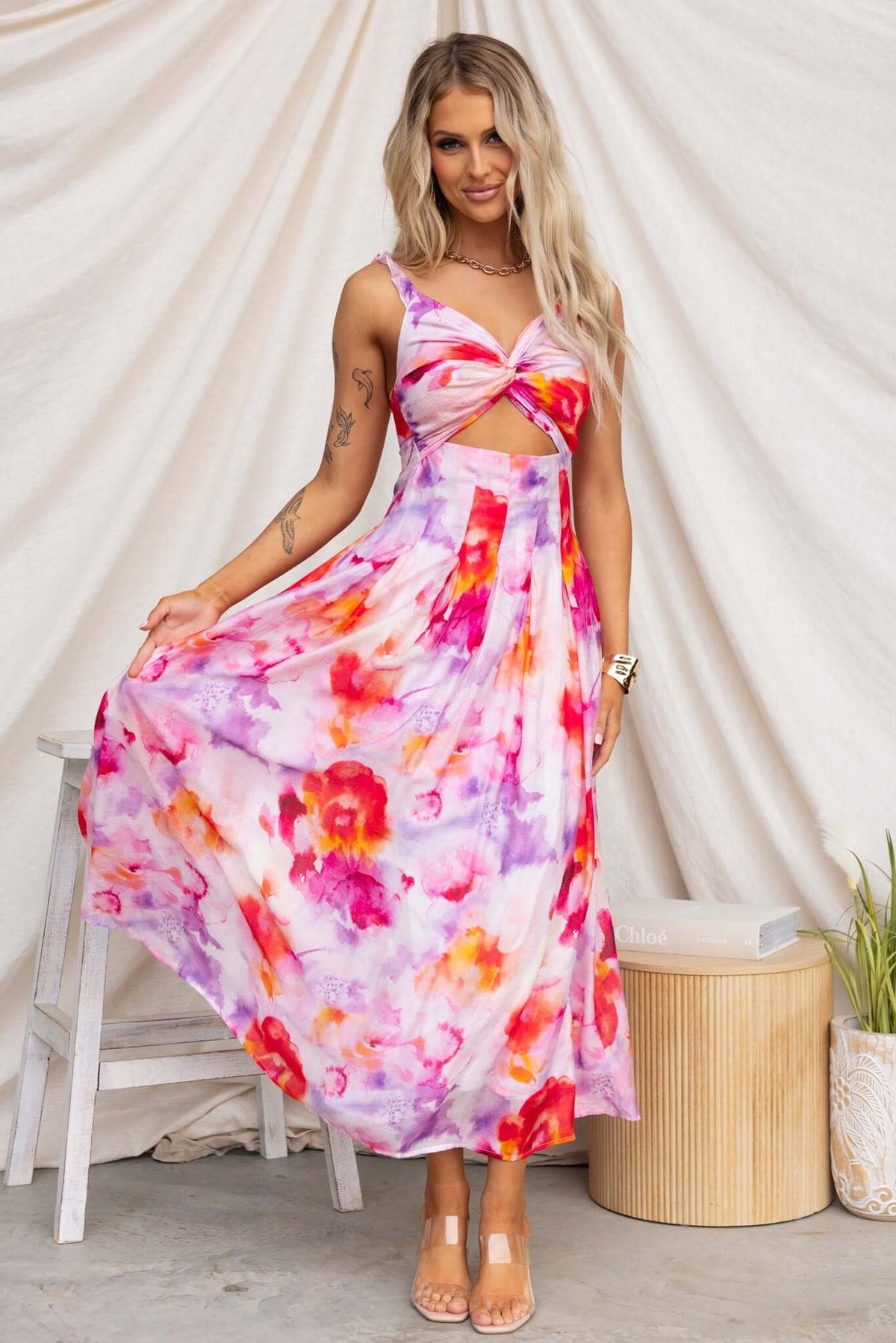 Estelle Midi Dress featuring elastic straps, waist cut-out, floral pattern, perfect for summer occasions.