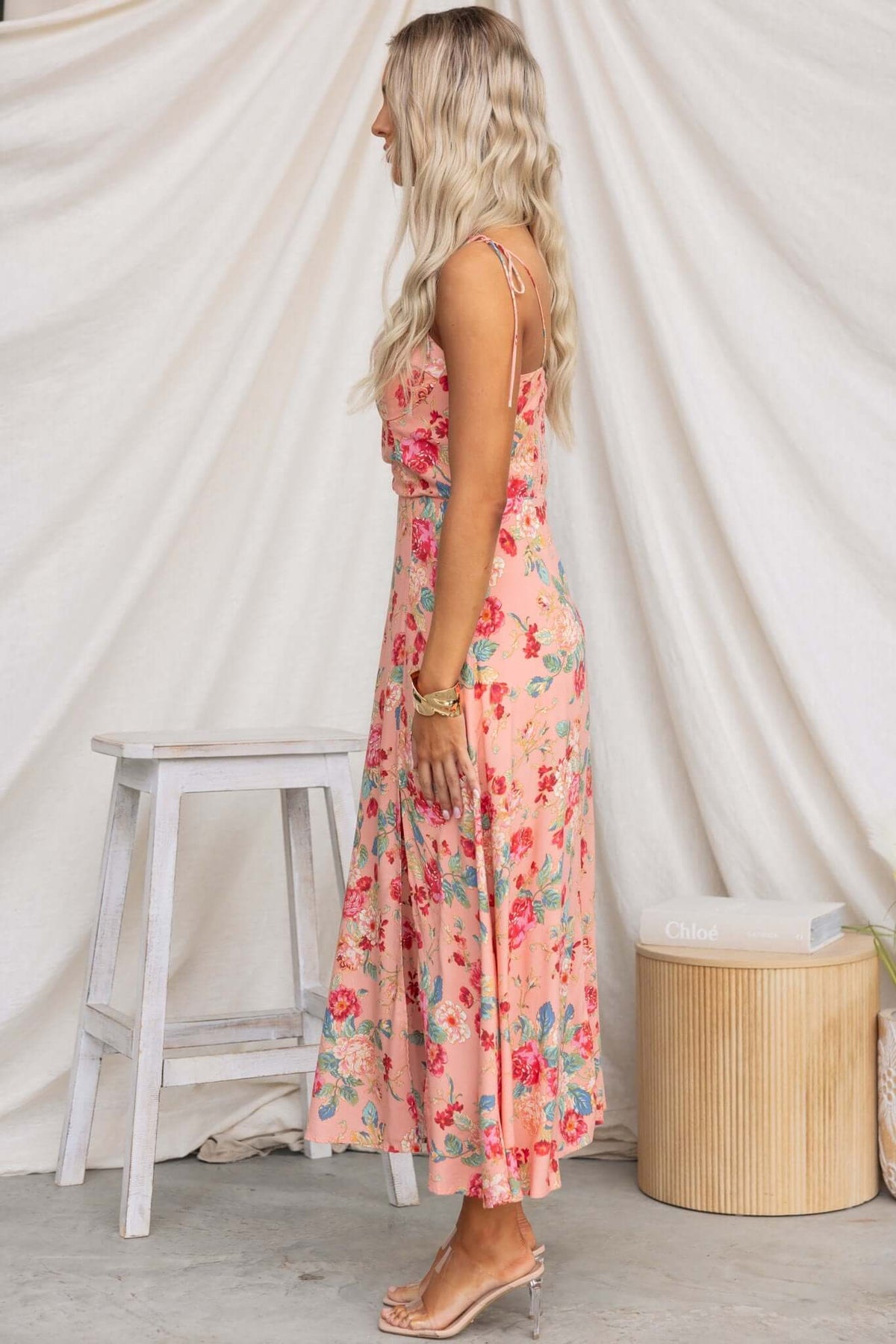 Side view of Briony Maxi Dress in floral print, featuring adjustable straps and a front split for a stylish, elegant look.