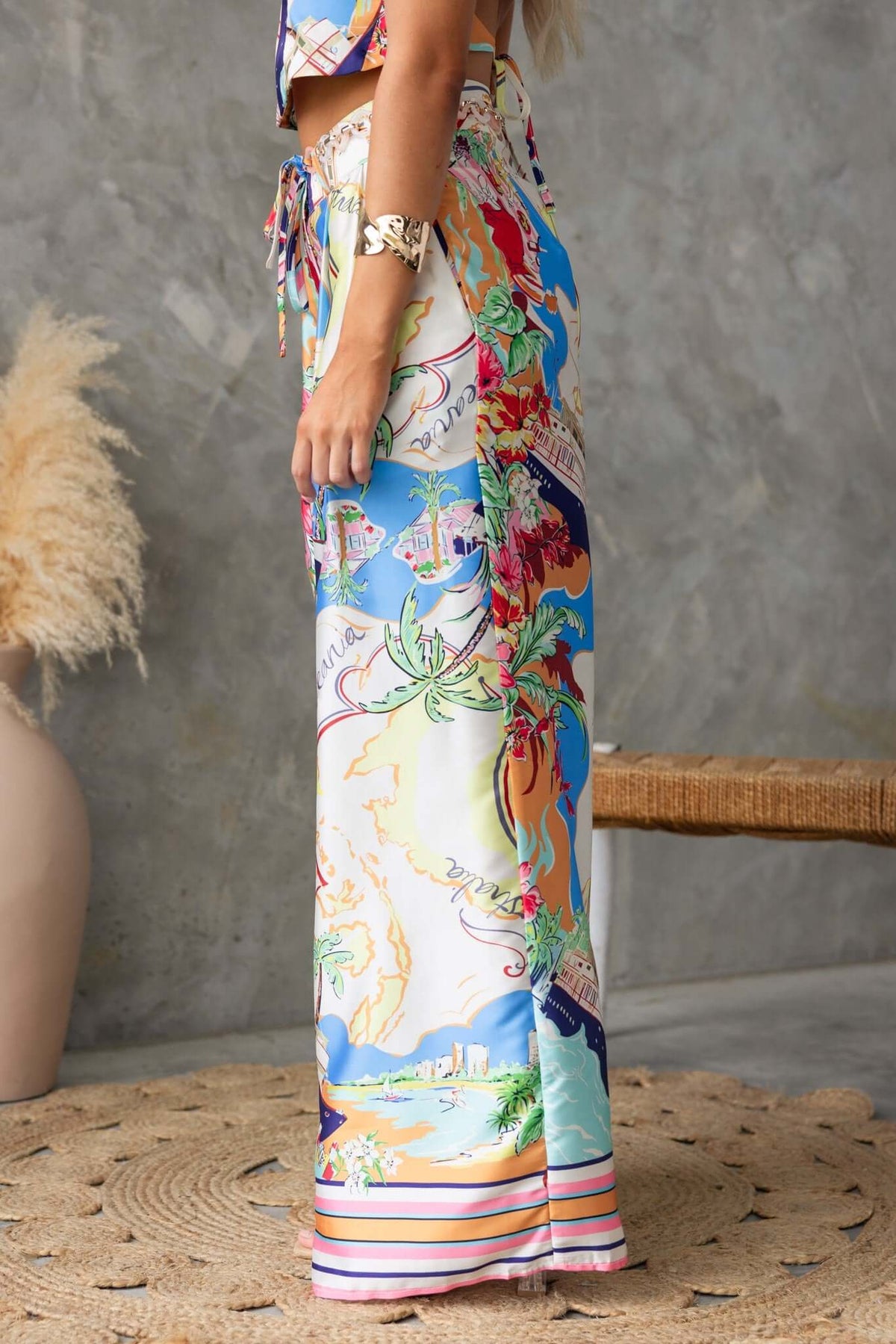 Side view of colorful Saluzzo Pants with mid-high waist, removable belt, showcasing vibrant prints and casual fit.