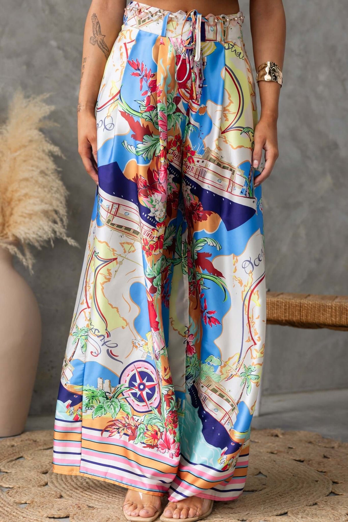 Colorful Saluzzo Pants with mid-high waist, removable belt, and pockets, styled for summer fashion.