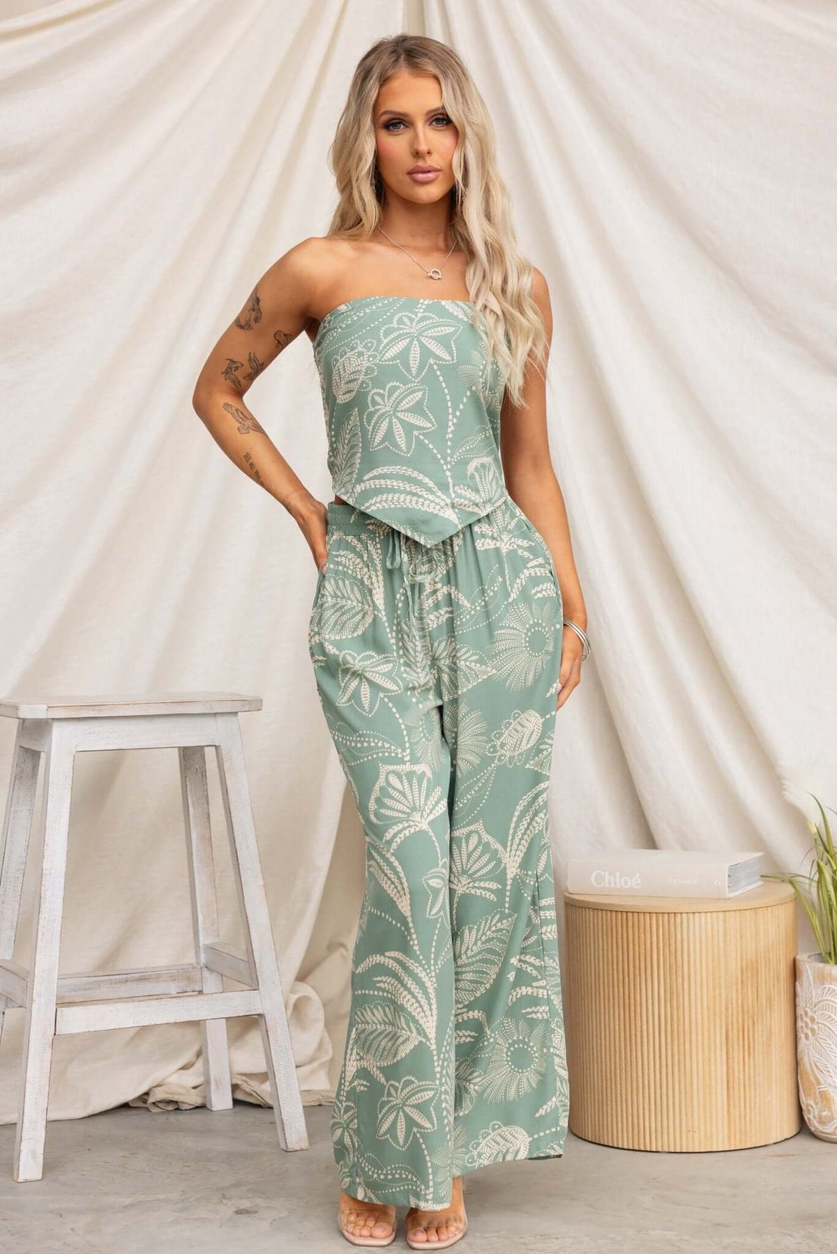 Lasan Set featuring a strapless top and mid-high waist pants in a green floral pattern, ideal for summer wear.