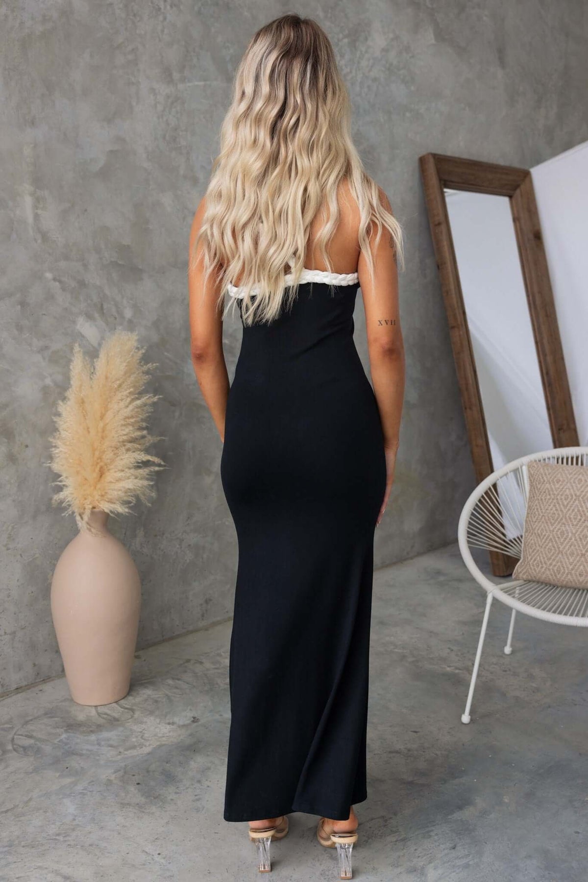 Sabyna Maxi Dress with one-shoulder neckline in black, showcasing a sleek fit and lightly ribbed material.