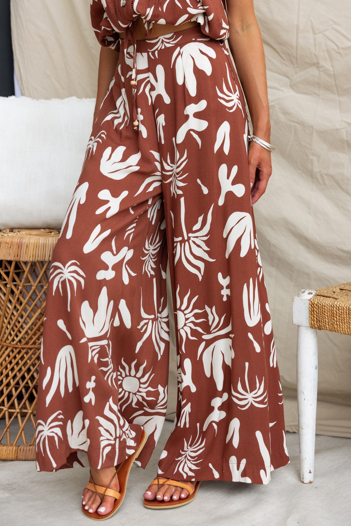 Ethan Pants featuring an abstract print, mid-high waist, and relaxed fit for a stylish summer look.