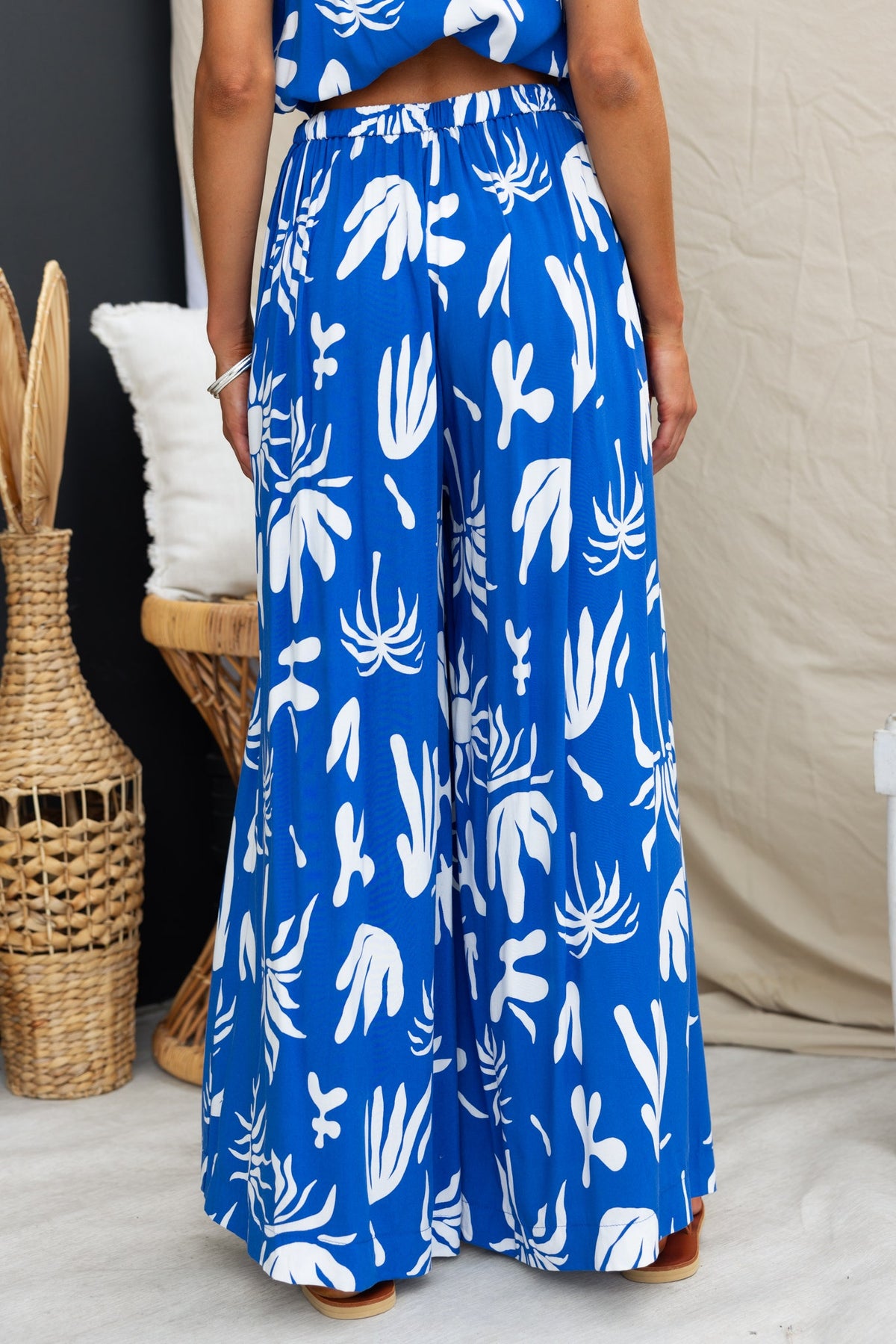 Ethan Pants featuring an abstract print, mid-high waist, and elastic back waistband, shown in a relaxed fit.