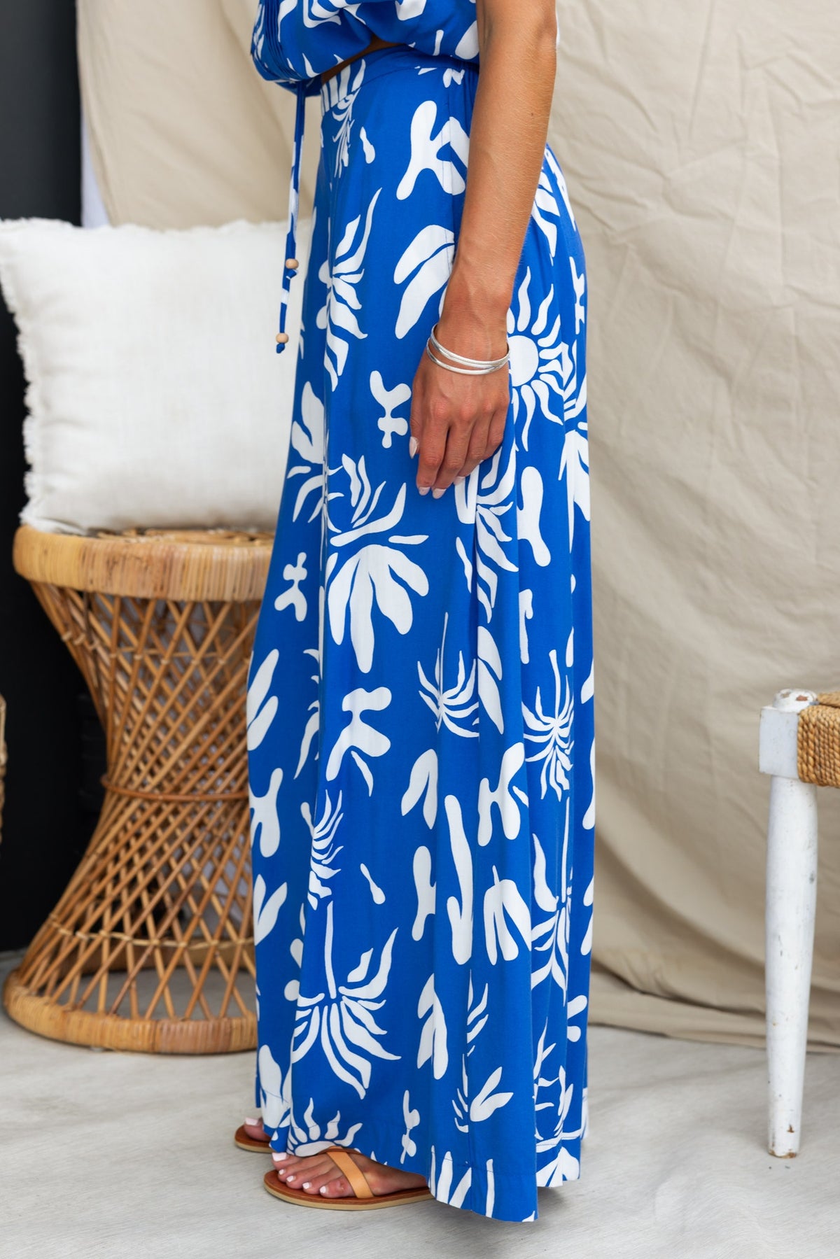 Ethan Pants feature an abstract blue and white print, mid-high waist, and pockets for a stylish, relaxed fit.