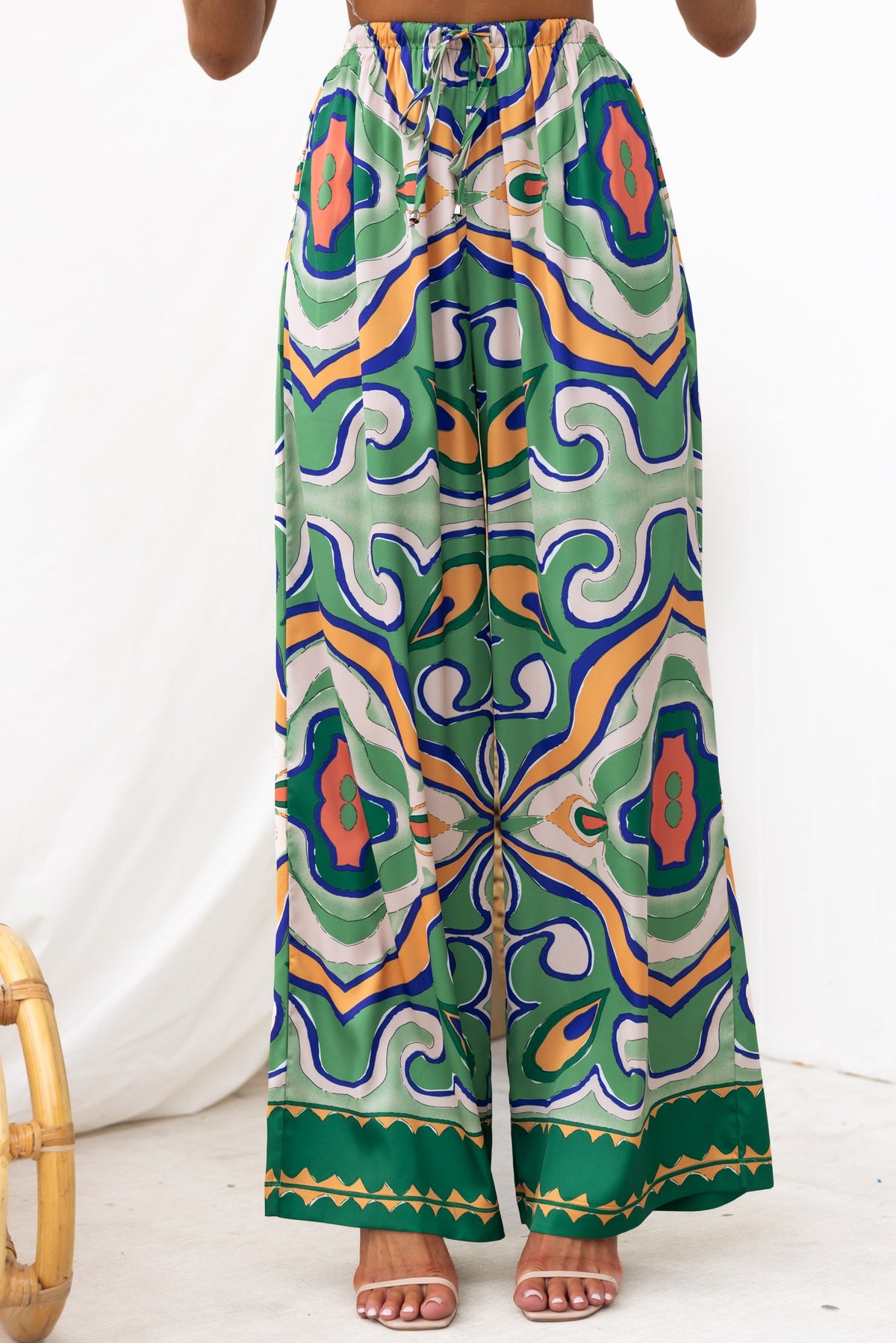 Up All Night Pants featuring abstract print, mid-high waist, elastic waistband, and pockets in vibrant colors.