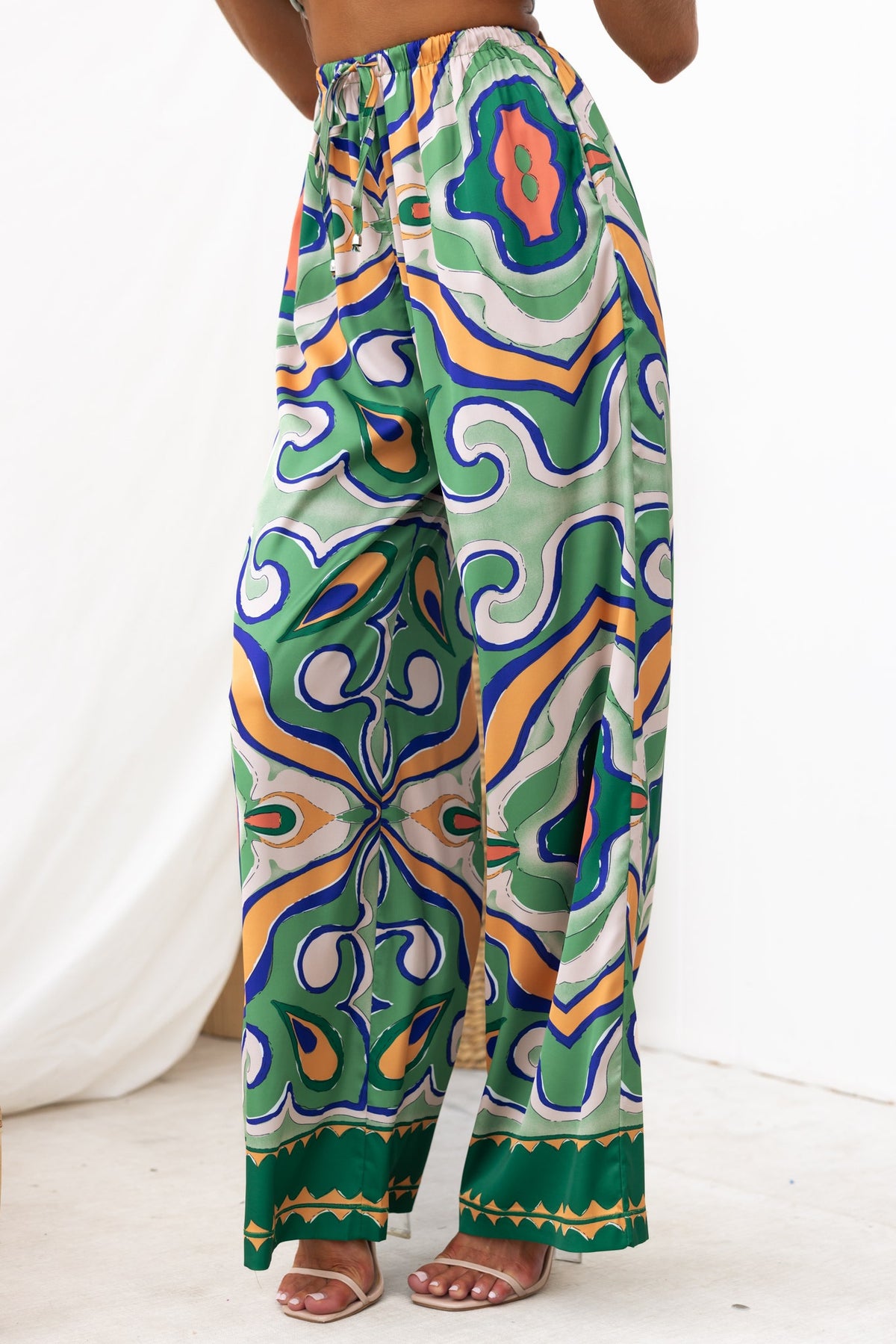Up All Night Pants featuring abstract print, mid-high waist, elastic waistband, and a satin feel.