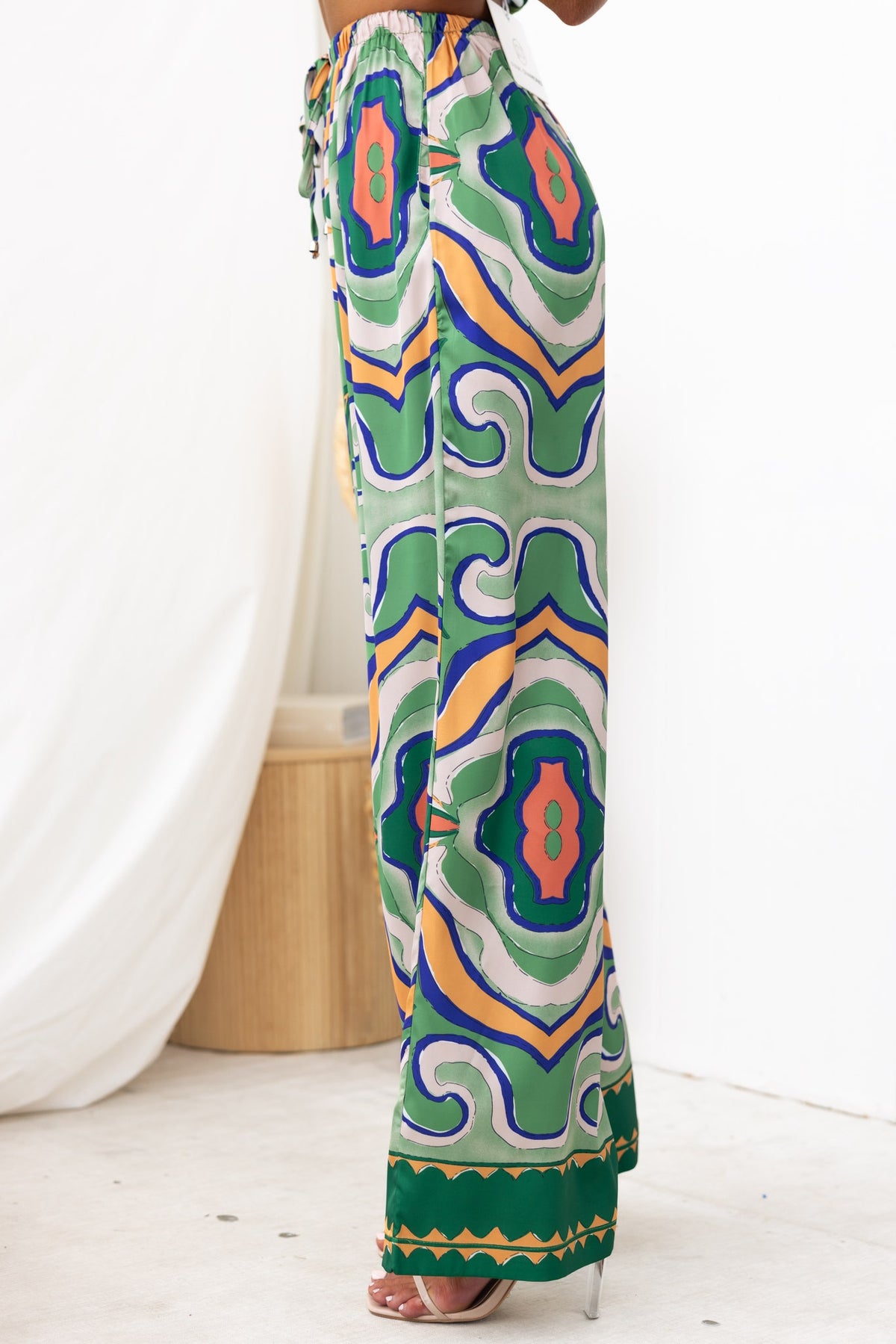 Stylish Up All Night Pants featuring an abstract print, mid-high waist, and elastic waistband with drawstring.