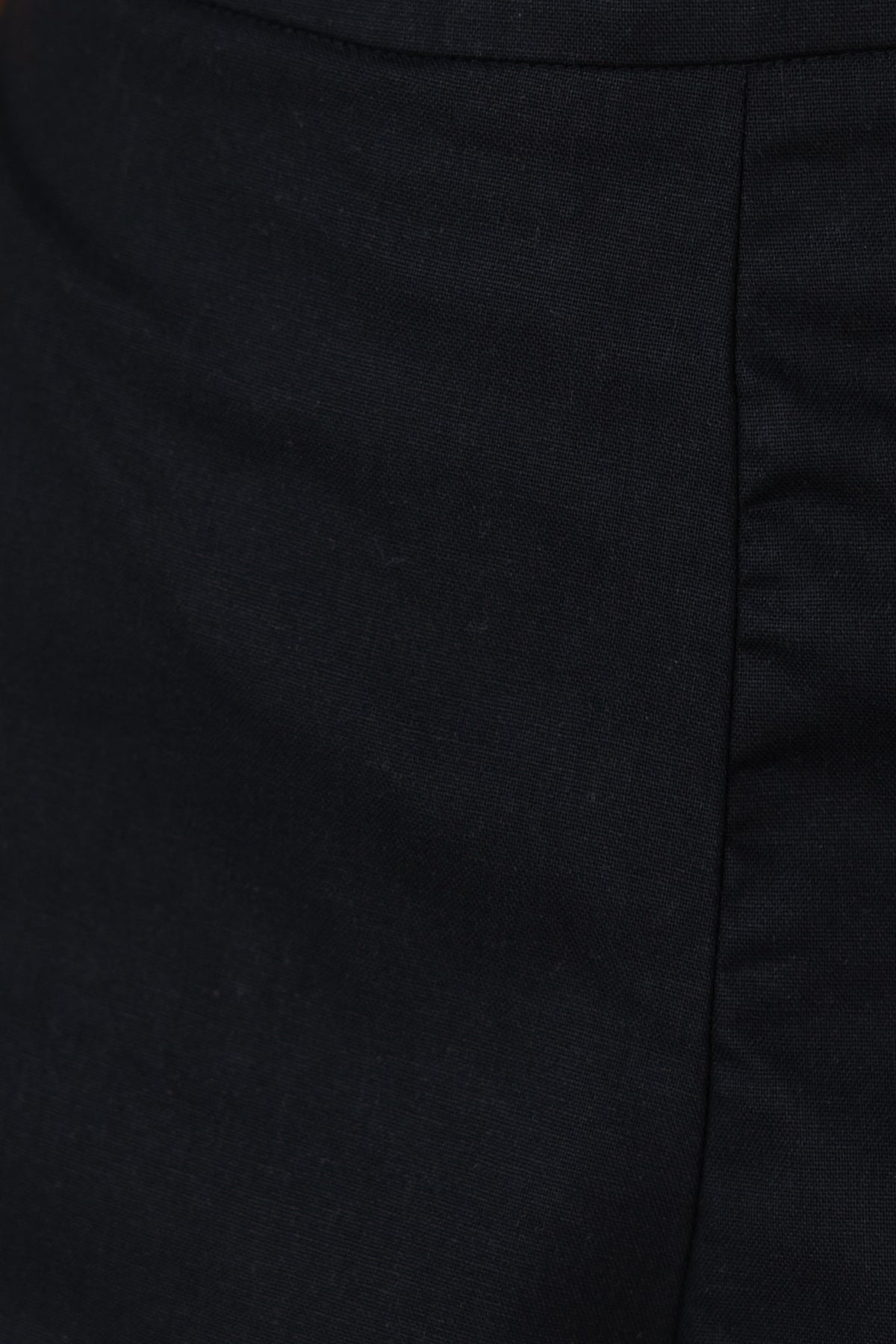 Close-up of Harriette Shorts showcasing the fabric texture and mid-high waist design in black.