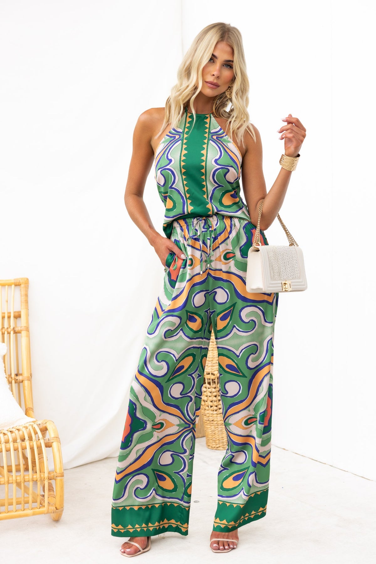 Model wearing Up All Night Pants featuring abstract print, mid-high waist, and elastic waistband with pockets.
