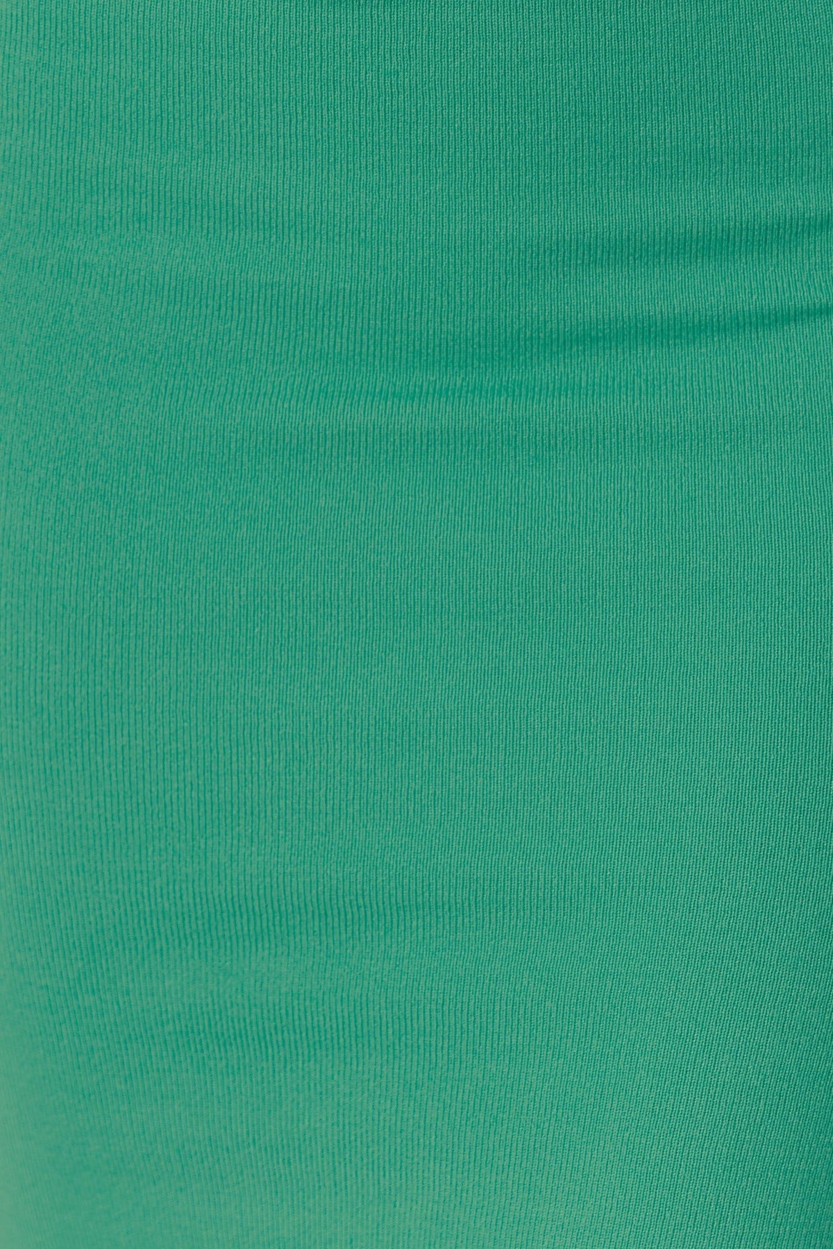 Close-up of the ribbed knit fabric of the Adelaide Midi Dress in a vibrant green color, showcasing its stretch texture.
