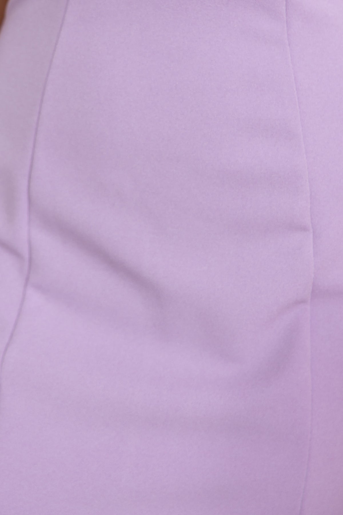 Close-up detail of lilac crepe fabric showcasing the smooth texture and stretch of the Tarsha Dress.