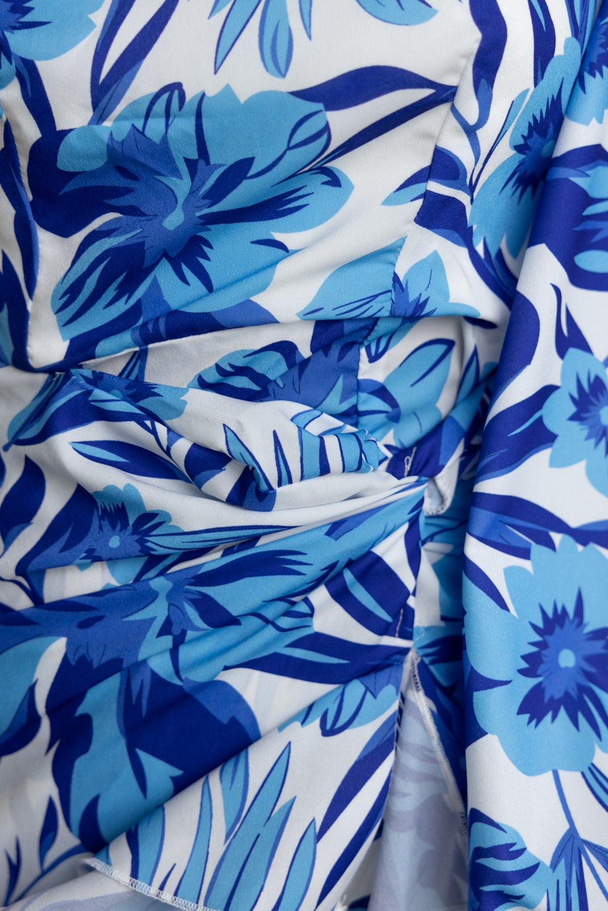 Close-up of floral print in blue tones on the Jovanna Midi Dress, showcasing the elegant fabric detail.