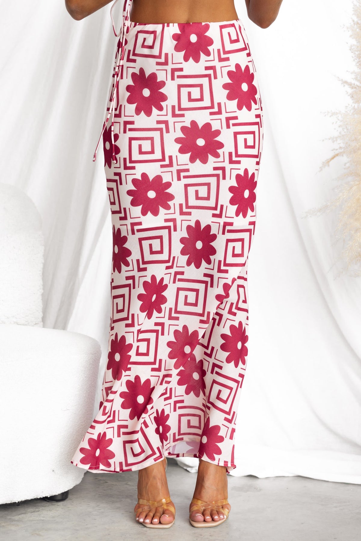 Stylish Solani Maxi Skirt featuring a floral pattern, mid-high waist, and comfortable elastic waistband.