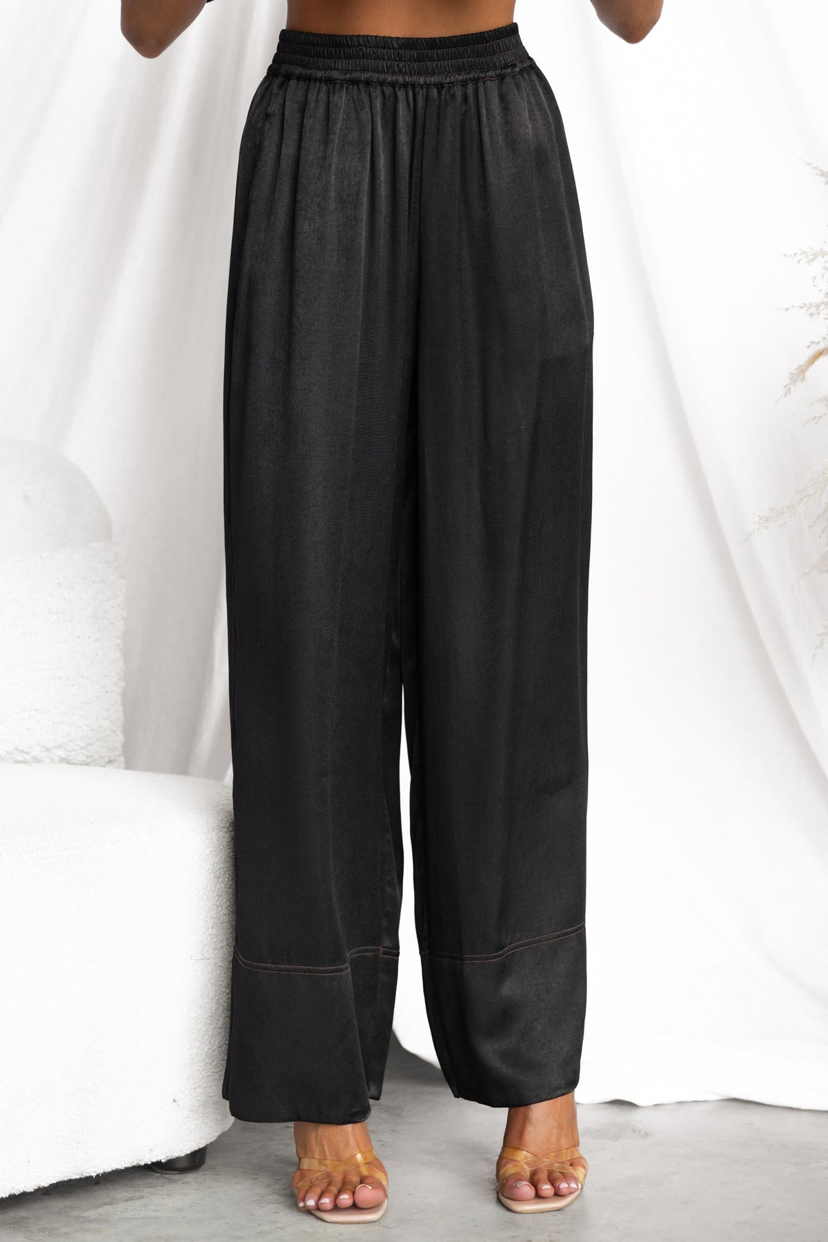 Noel Pants - Black mid-high waist trousers with elastic waistband, soft silky feel, and relaxed fit.