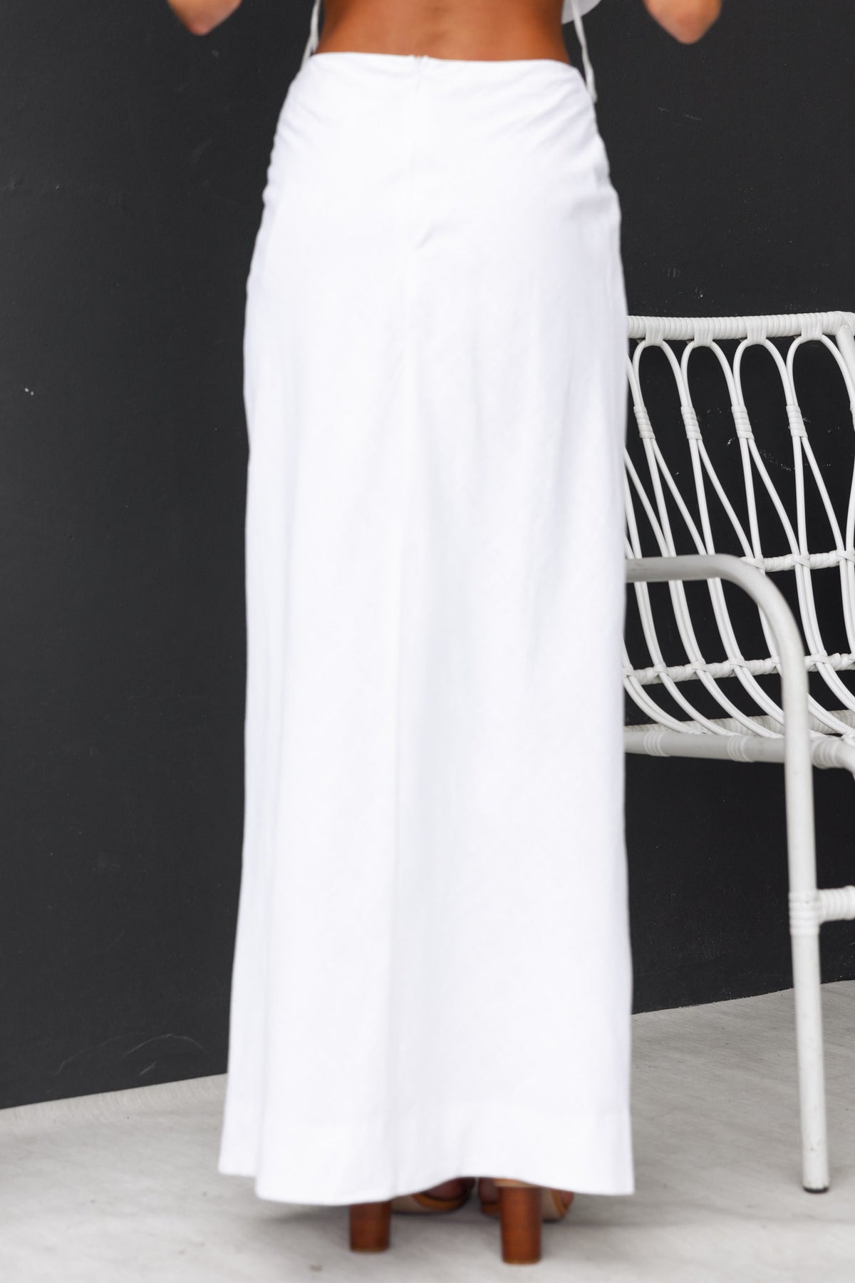 Back view of the Bexley Maxi Skirt in white, featuring a mid-high waist and elegant, flowing design.