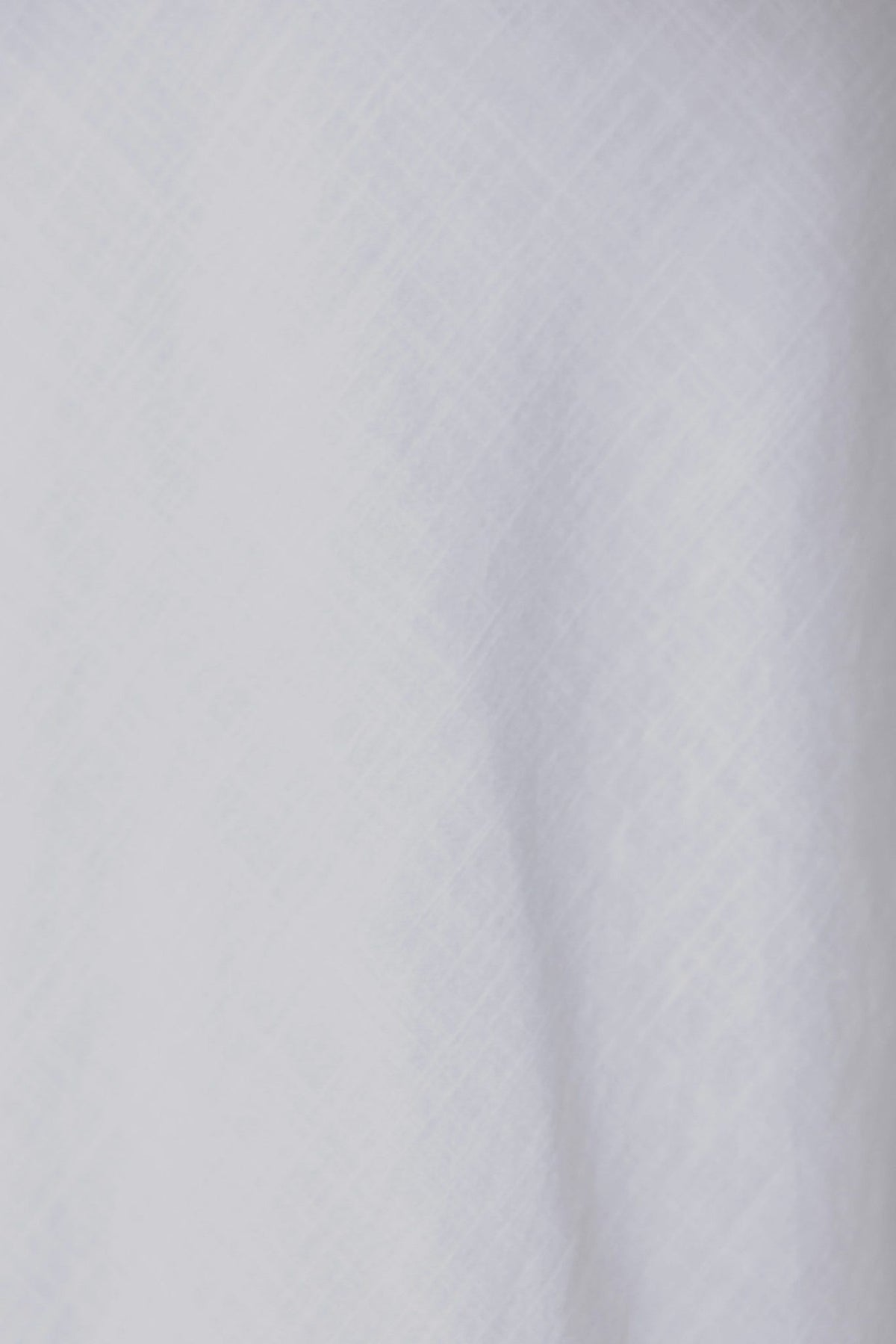 Close-up of white textured fabric showing a linen look, ideal for the Bexley Maxi Skirt design.
