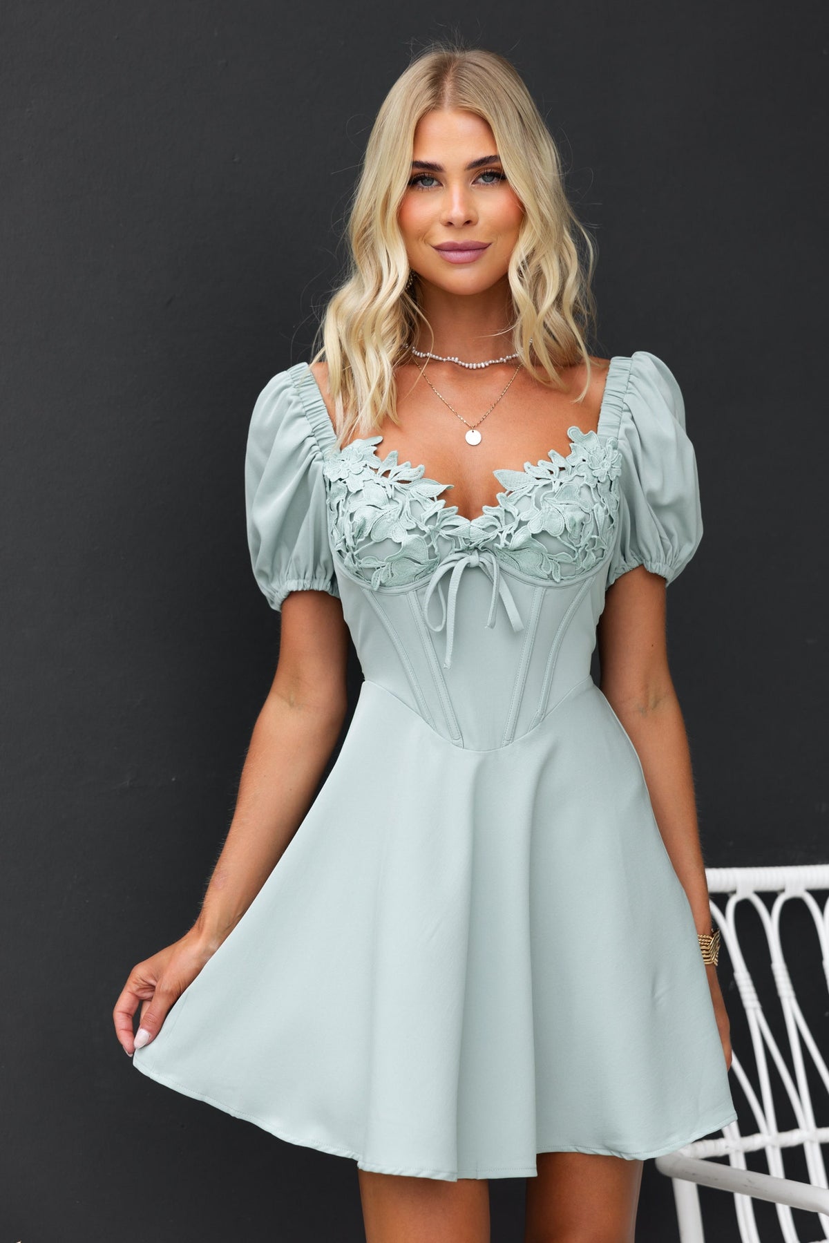 Nonny Dress in light mint green with lace detail at bust and elastic sleeves, perfect for summer occasions.