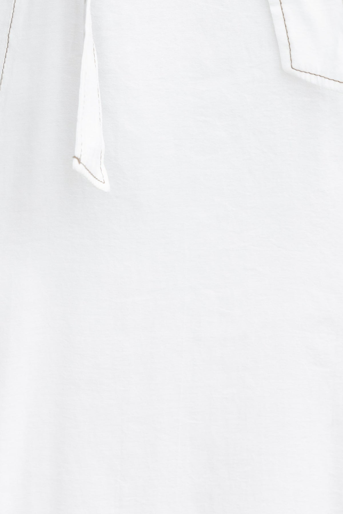 Close-up of the Orderly Midi Dress, showcasing fabric tie detail and smooth light material.