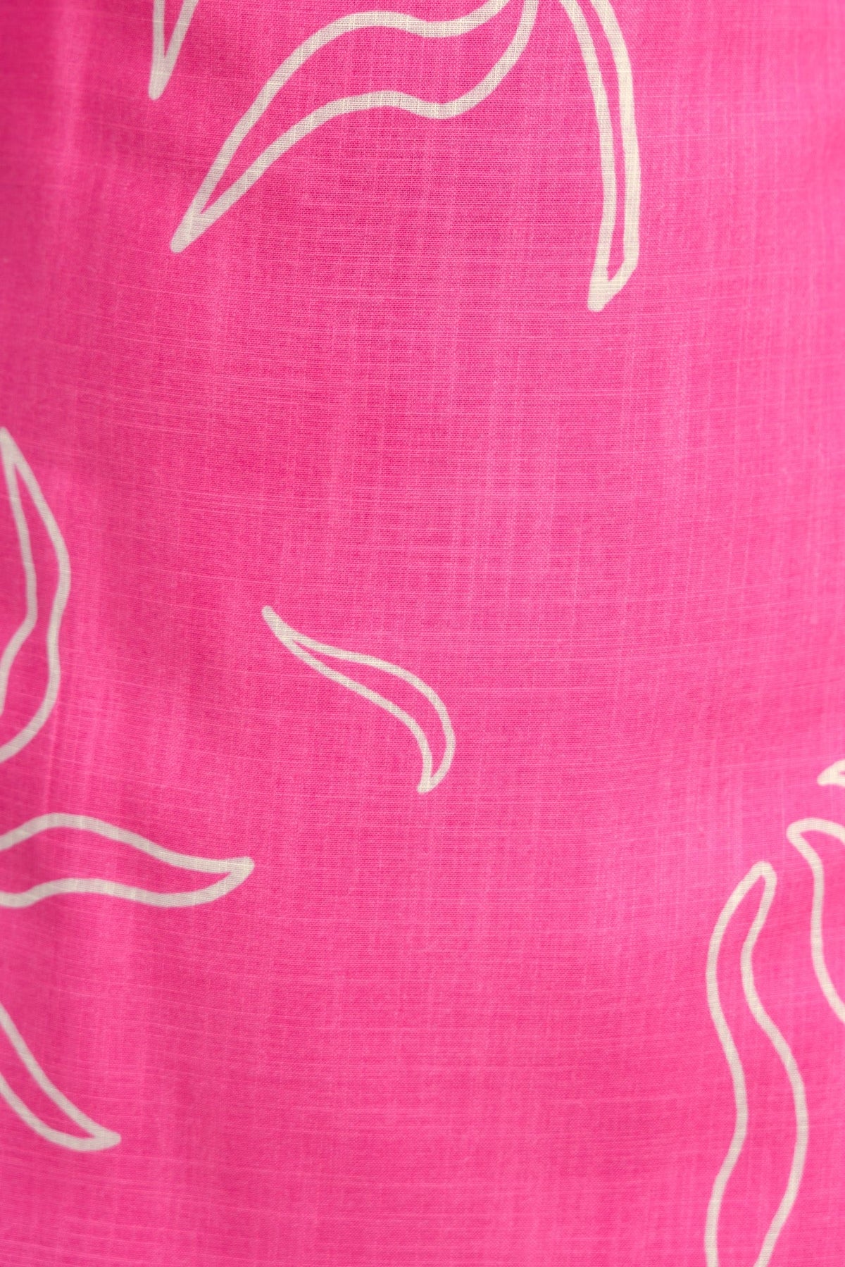 Pink floral print fabric with white abstract leaf patterns, ideal for a cheerful and stylish summer dress.