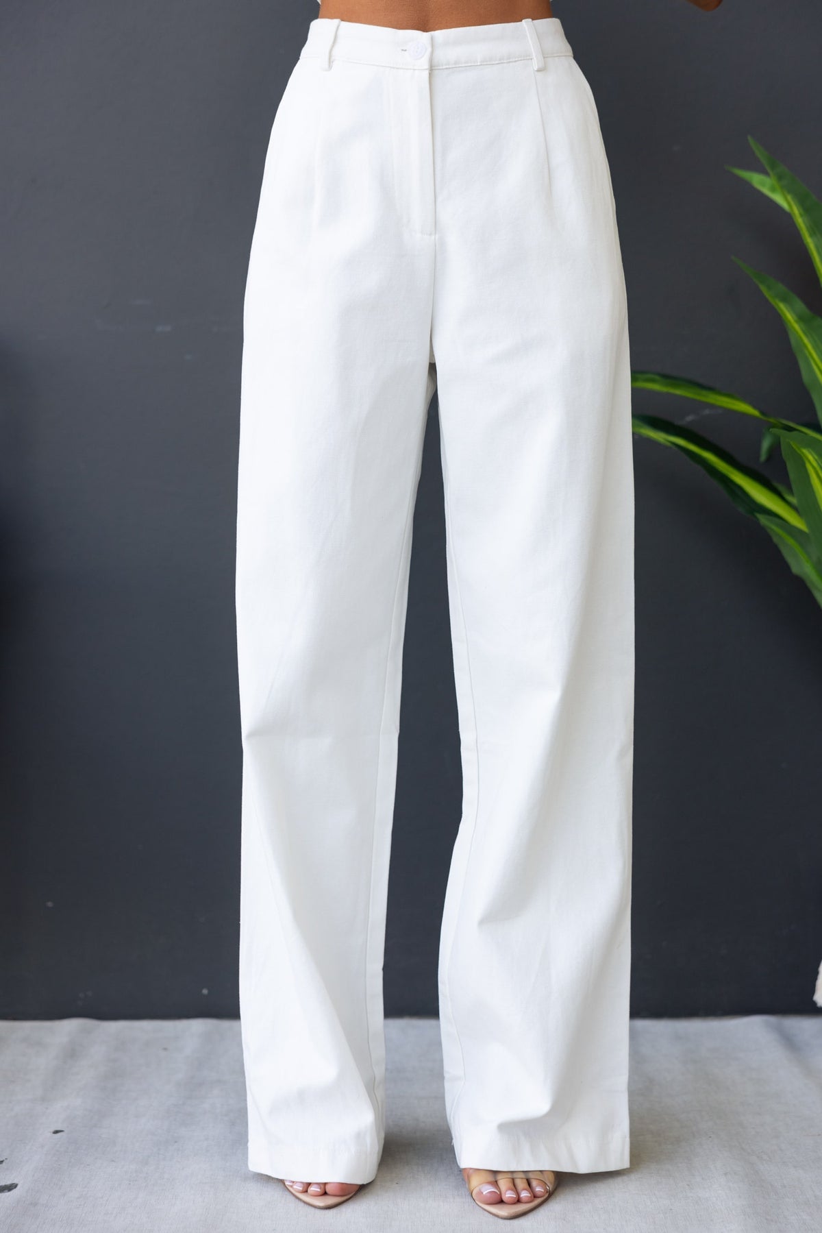 Rayden Denim Pants in white with wide legs, mid-high waist, and front pockets, perfect for a stylish casual look.