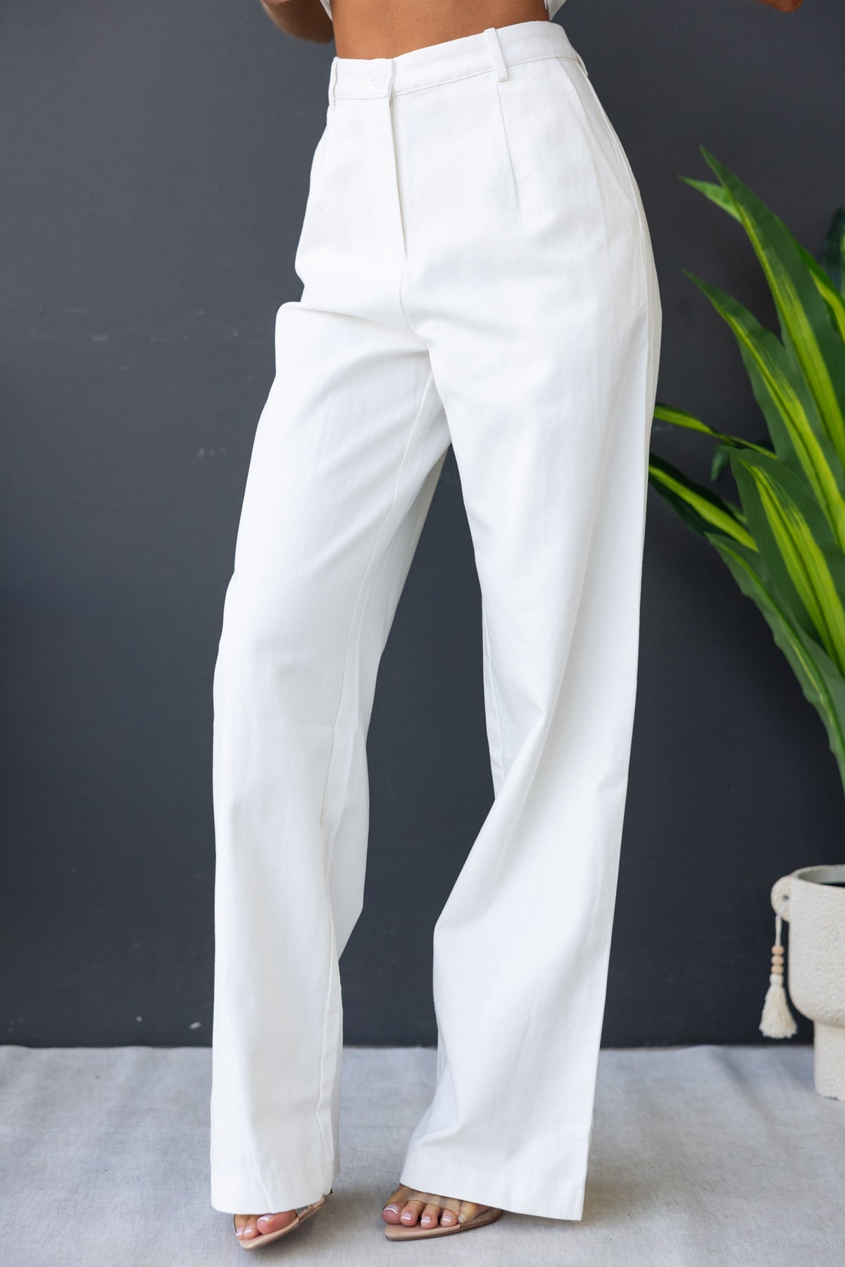 Rayden Denim Pants in white, mid-high waist, wide leg fit, featuring front pockets and a sleek, stylish design.
