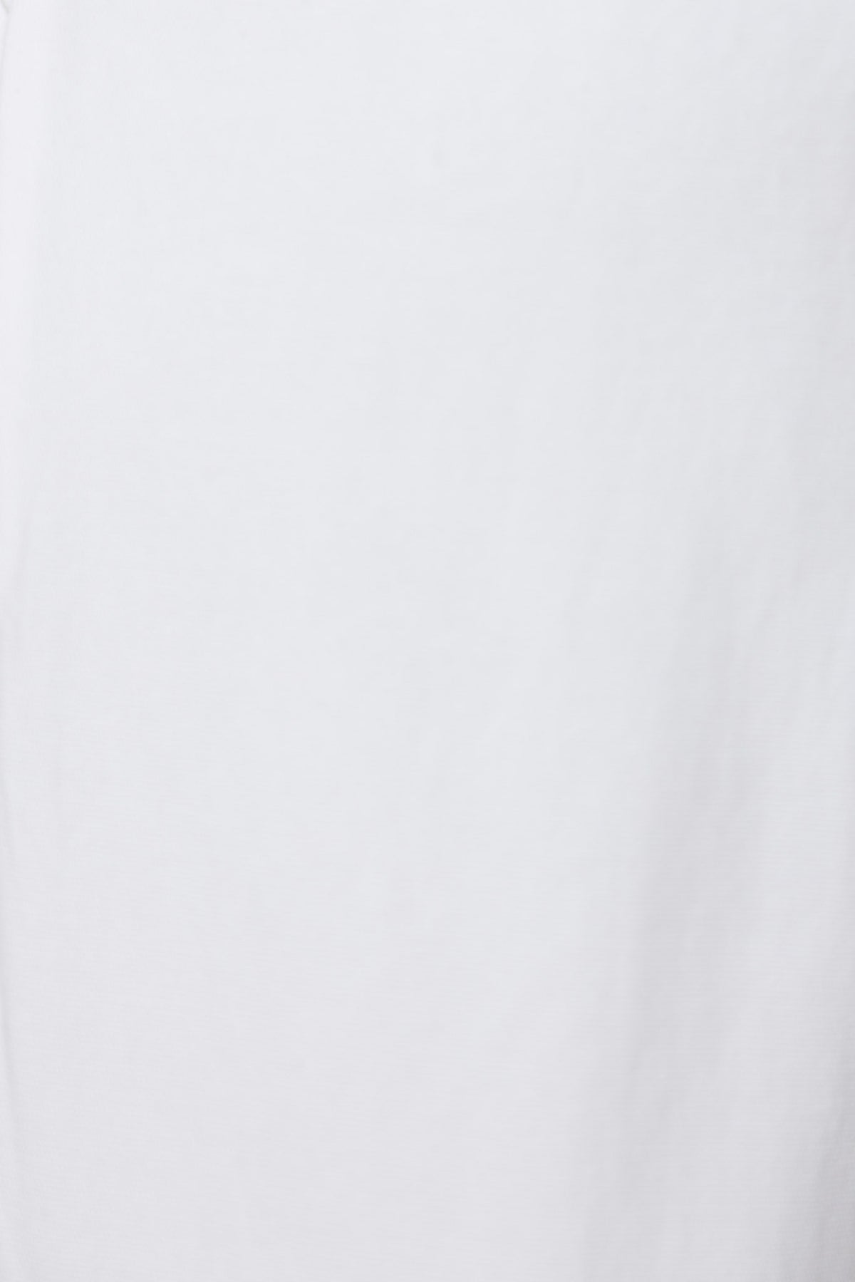 Close-up of plain white fabric with a smooth texture, ideal for casual wear and layering in wardrobe essentials.