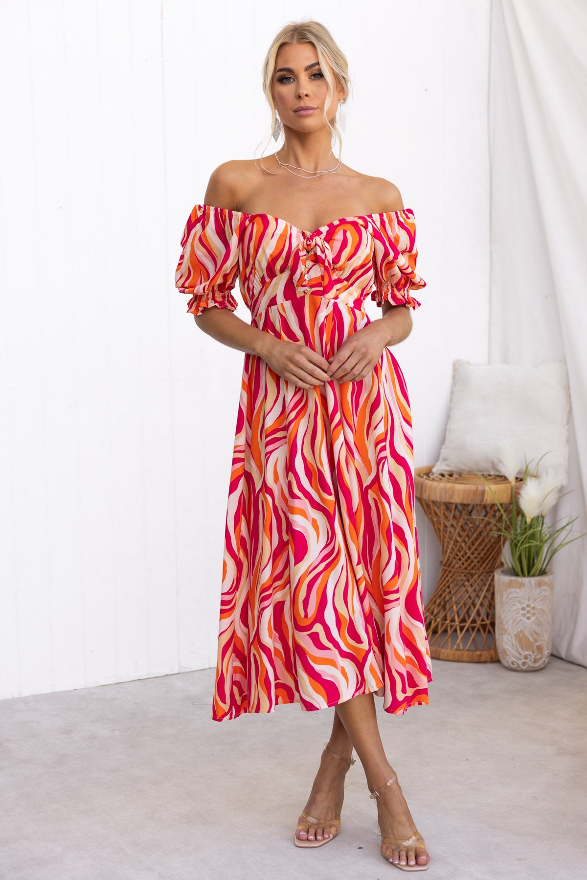 Rayanna Midi Dress in colorful wave print, featuring off-shoulder sleeves and a tie detail at the bust.