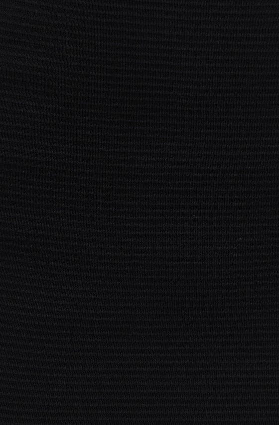 Close-up of a black textured fabric, showcasing the material of the Raiza Skirt, made from 100% viscose.