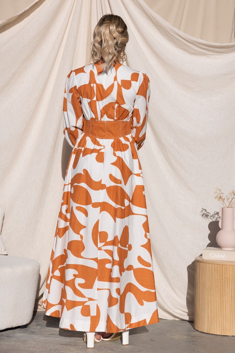 Back view of Bohemia Maxi Dress in multi-colour print, featuring a round neckline and invisible zip closure.