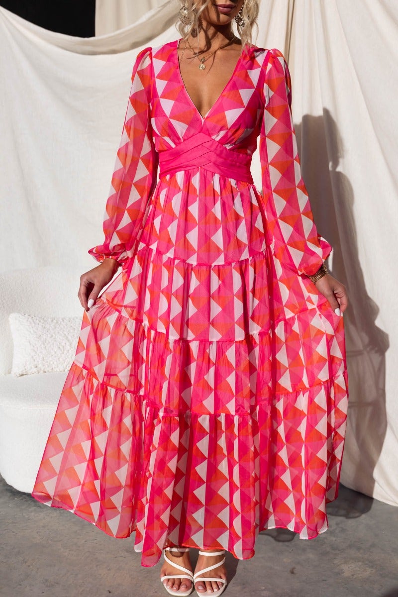 Cotta Maxi Dress featuring a vibrant multi-color geometric pattern, V-neckline, and tiered design, perfect for summer events.