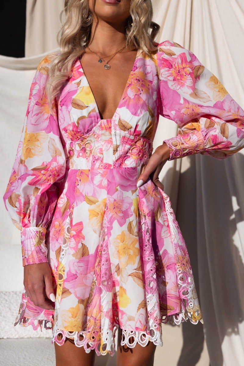 Chasing Dreams Dress in pink floral with V-neckline and lace detailing, perfect for casual outings and special occasions.