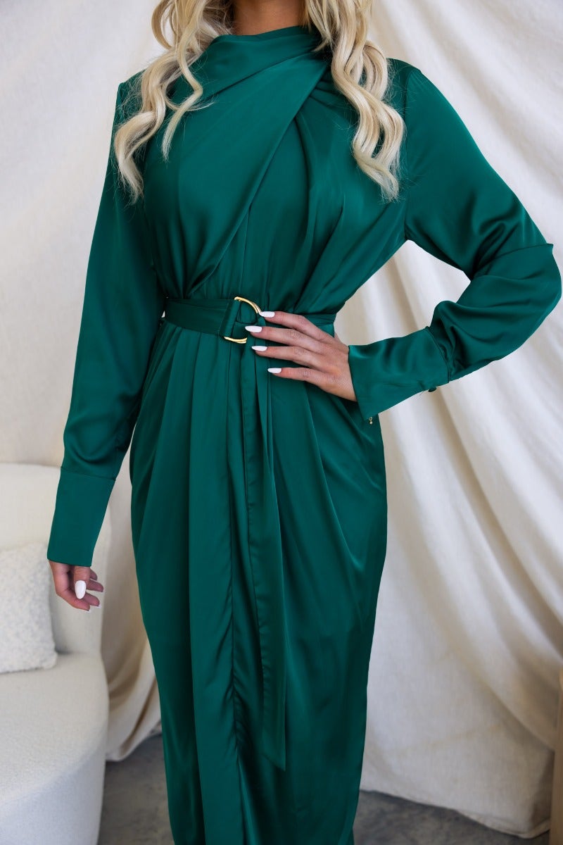 Maranta Midi Dress in green, featuring a high neckline, tie detail, and removable fabric belt, styled elegantly.