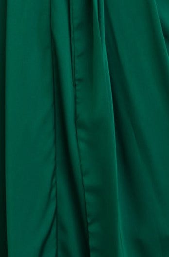 Close-up of the satin fabric of the Maranta Midi Dress, showcasing its rich green color and smooth texture.