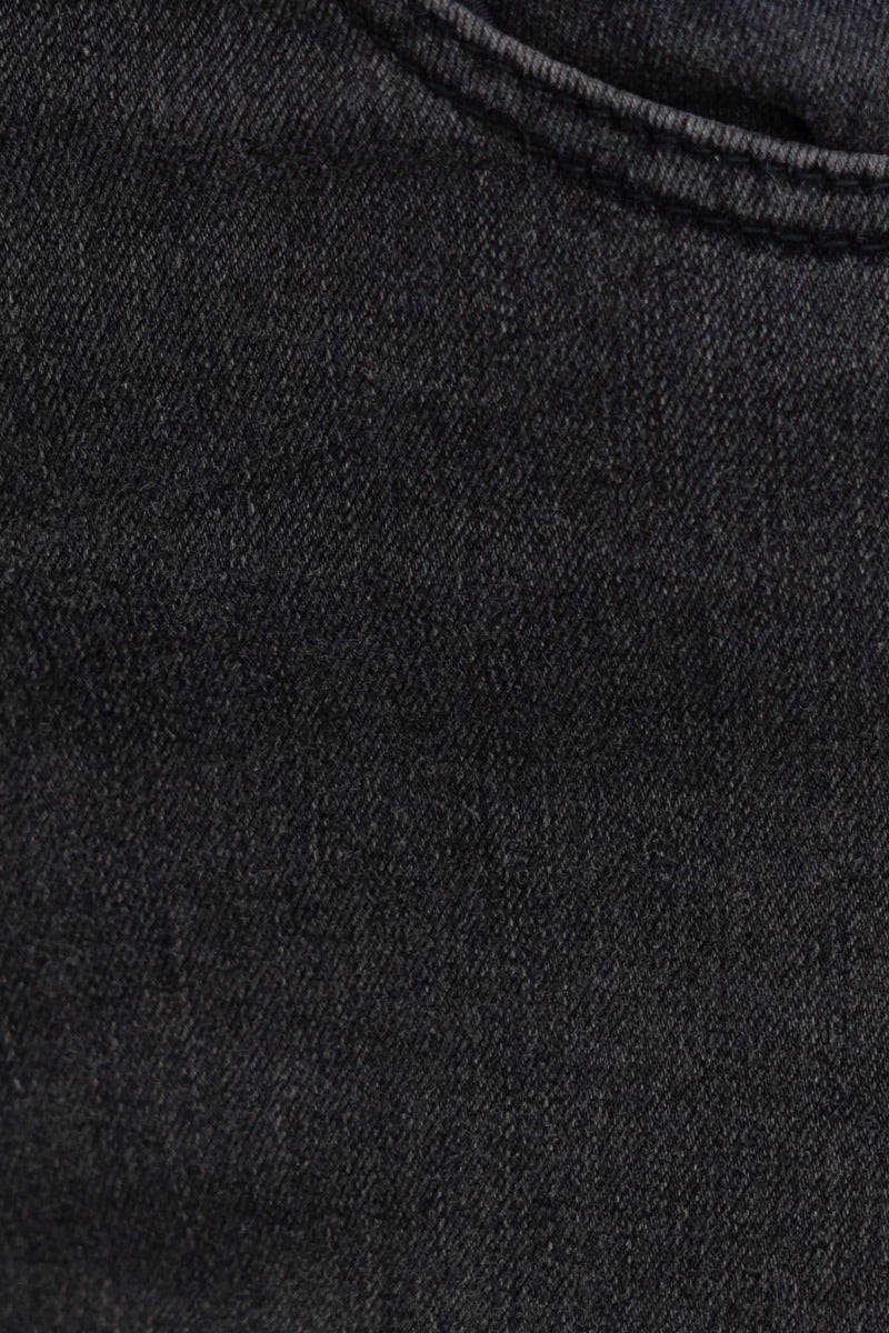 Close-up of washed black denim fabric showcasing texture and color variation for Dion Jeans.