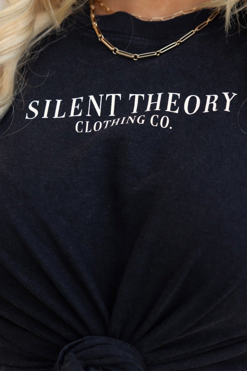 Close-up of the Jerome Tee in washed black with 'Silent Theory Clothing Co' print, featuring round neckline and relaxed fit.