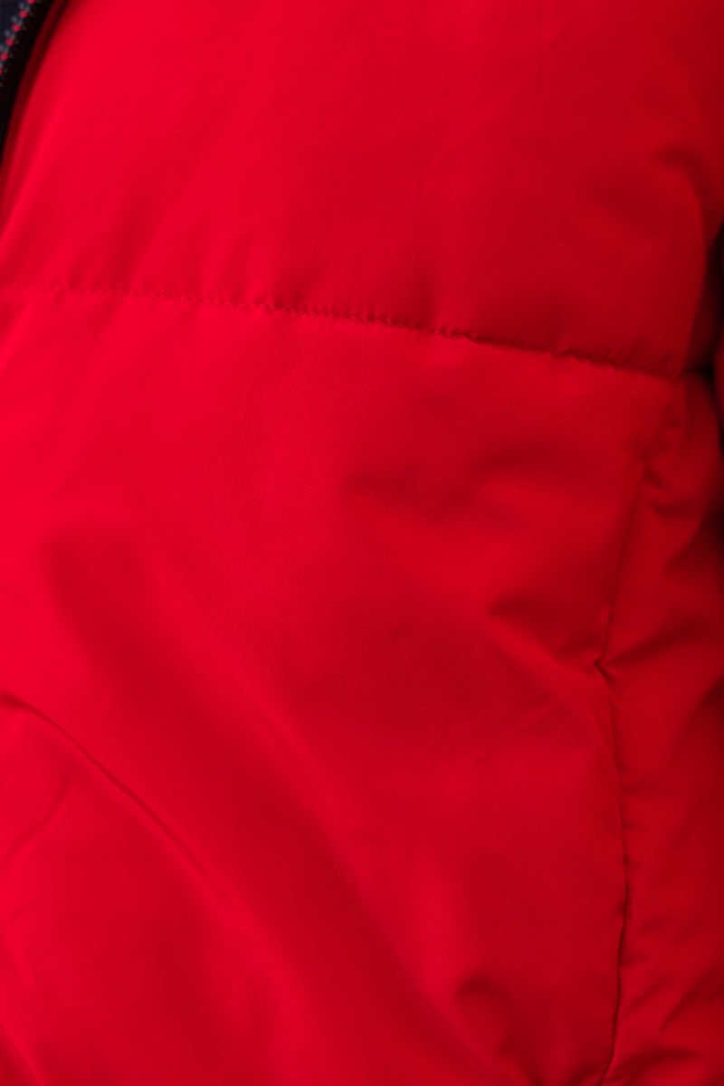 Close-up of the Delila Puffer Jacket in vibrant red, showcasing soft fabric and quilted texture.