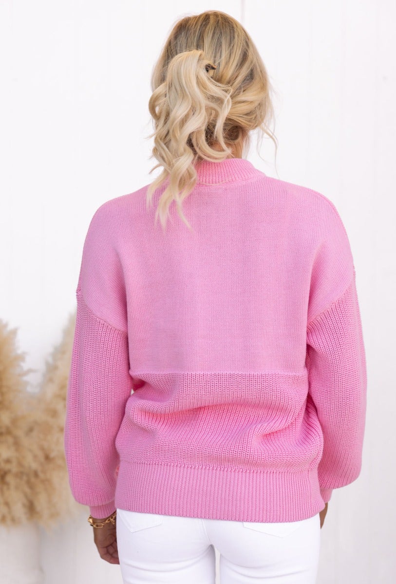 Back view of the pink Raymer jumper featuring a round neckline and soft knit material, perfect for casual wear.