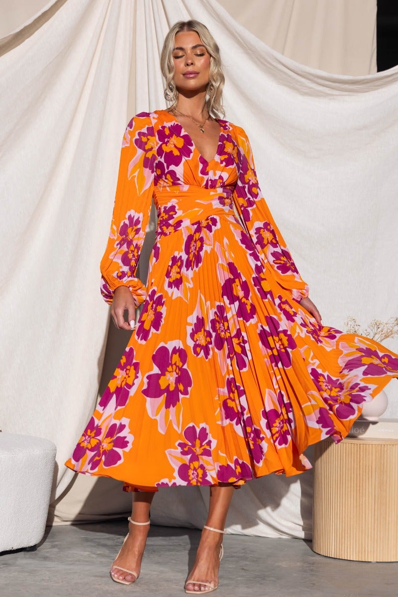 Normia Midi Dress featuring vibrant floral print, V-neckline and pleated skirt, ideal for stylish occasions.