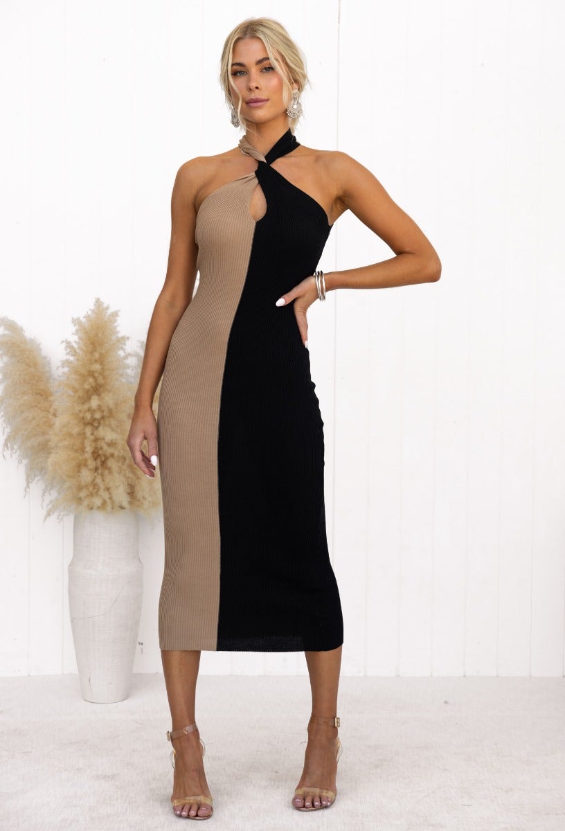Brinney Midi Dress in black and beige, ribbed knit, with twist detail and high neckline, showcasing a stylish fit.