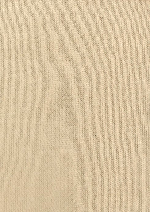 Close-up of beige knitted fabric texture, showcasing soft and stretchy material ideal for comfortable clothing.