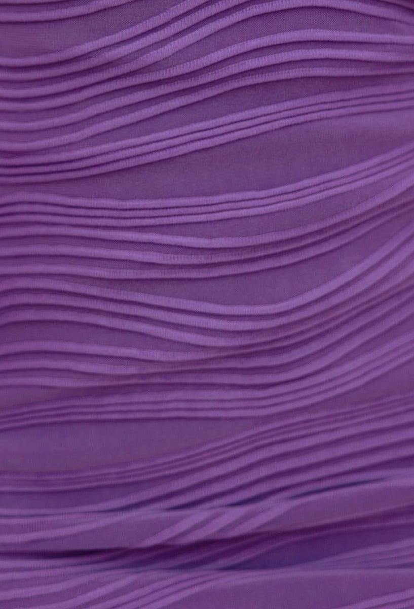 Textured purple fabric detail of the Toscani Maxi Dress, showcasing elegant wavy patterns.